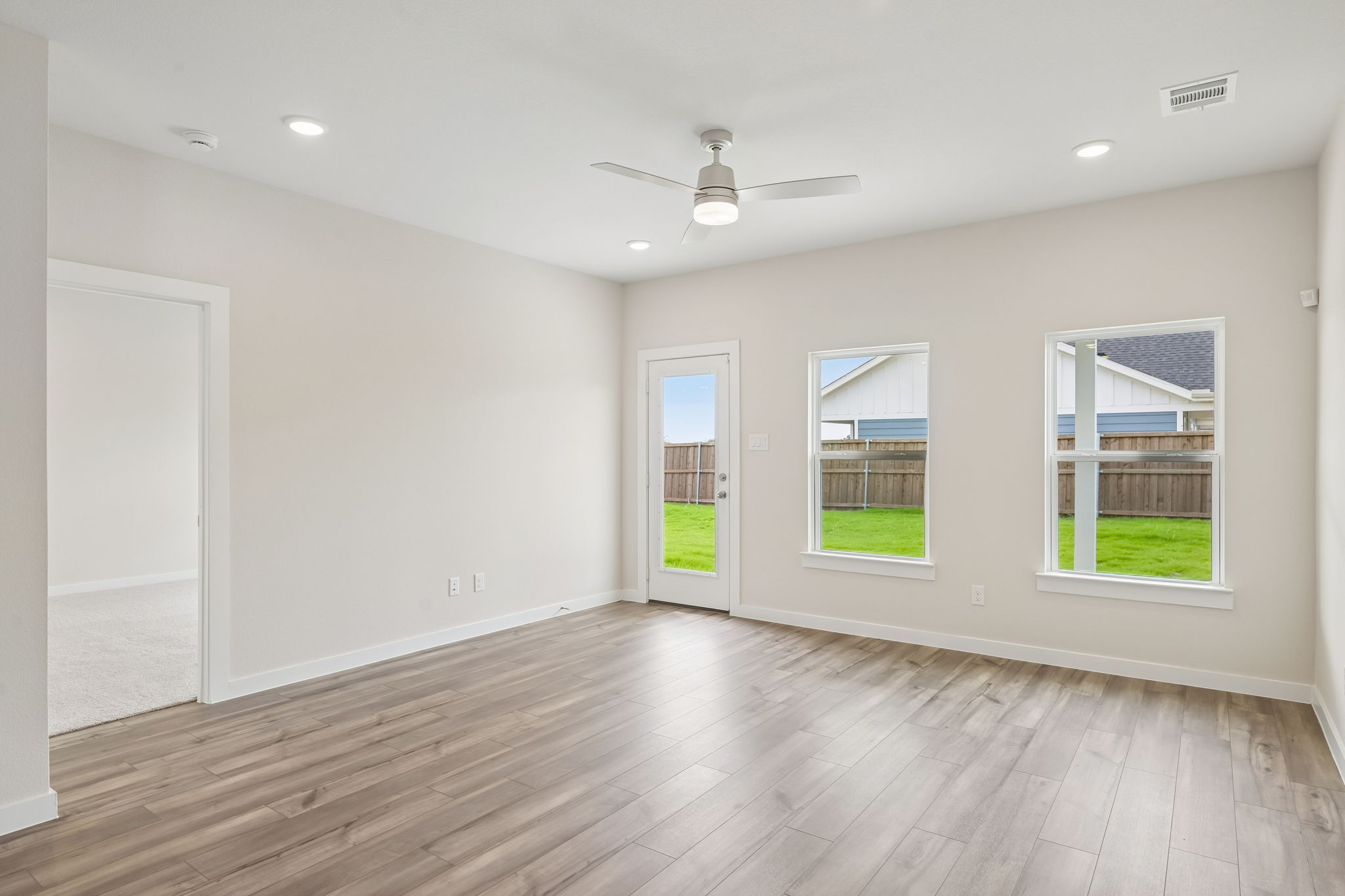 A room with a wood floor and a wood floor with a wood floor.