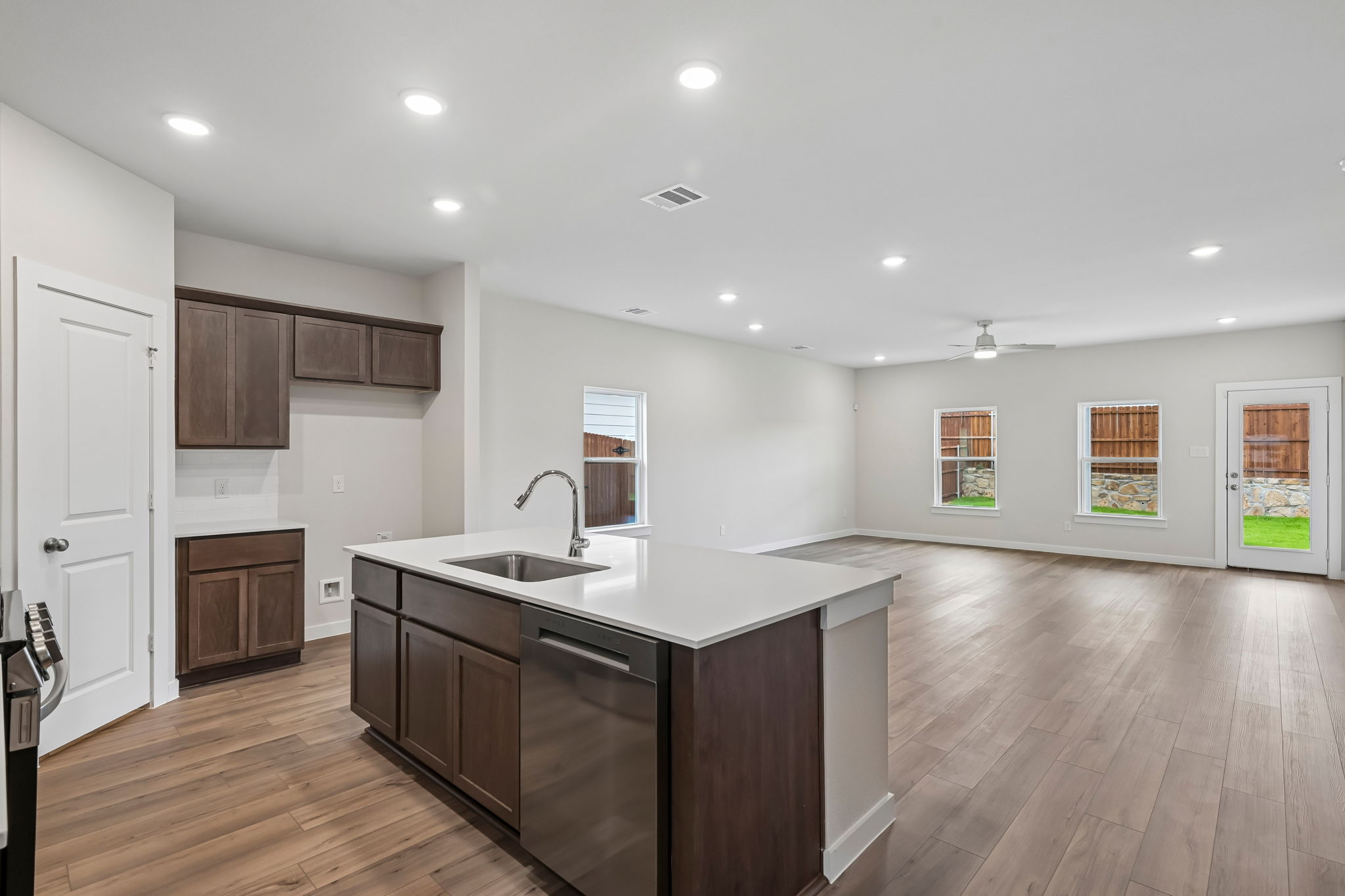 A kitchen with wooden cabinets.