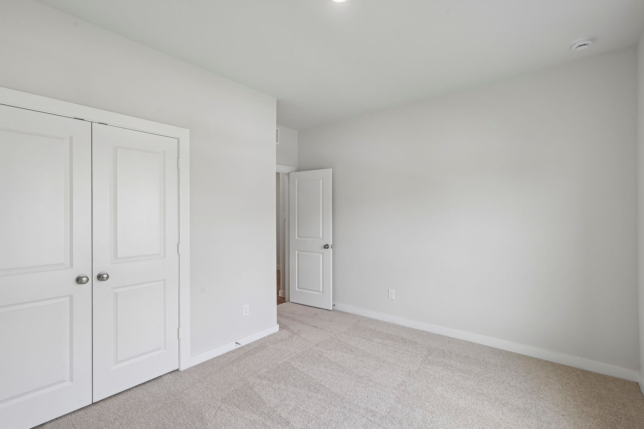 A room with white doors.