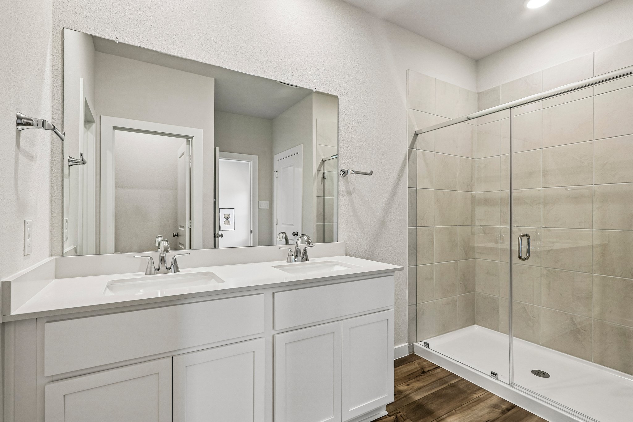 A bathroom with a glass shower.