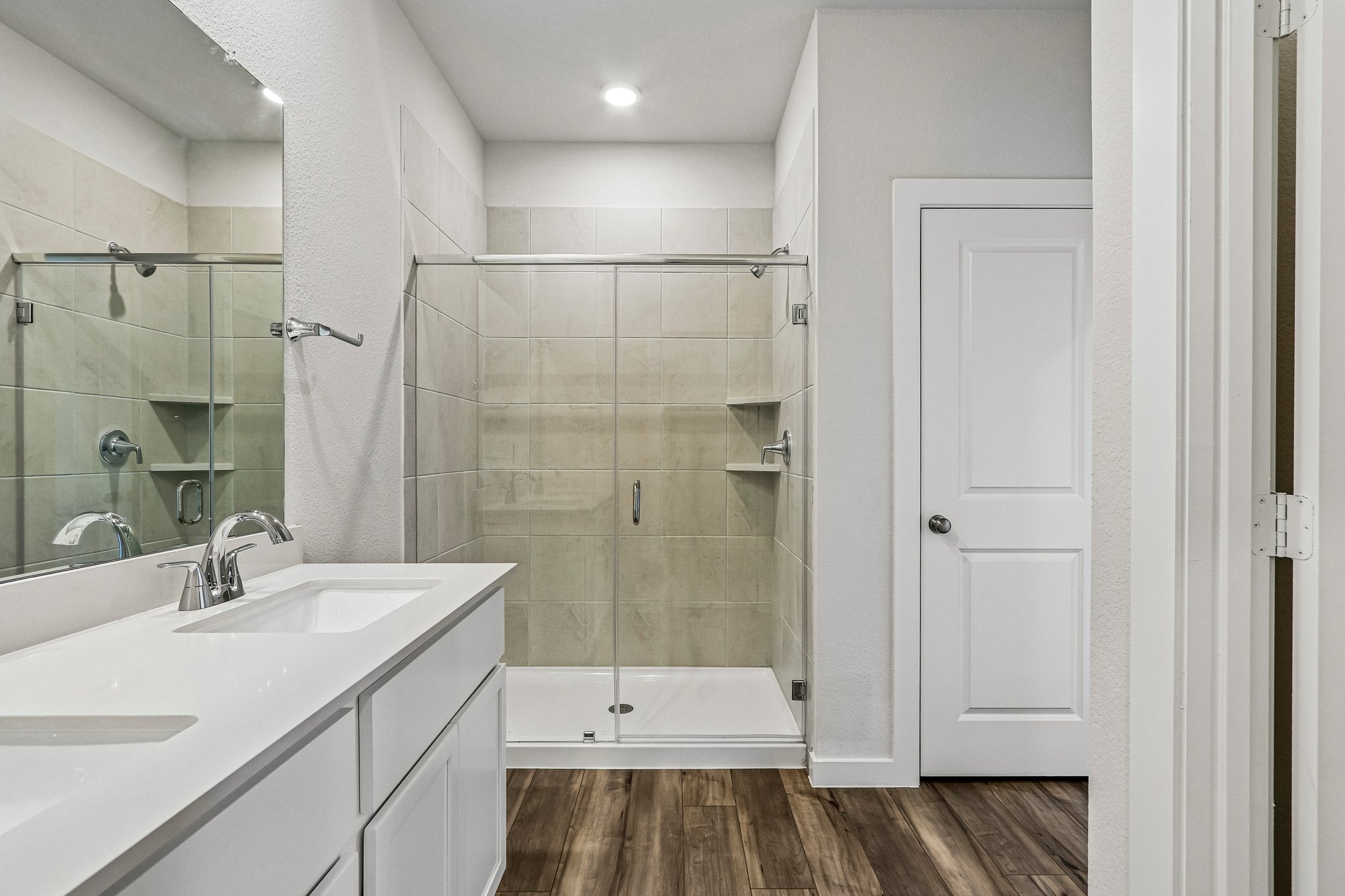 A bathroom with a glass shower.