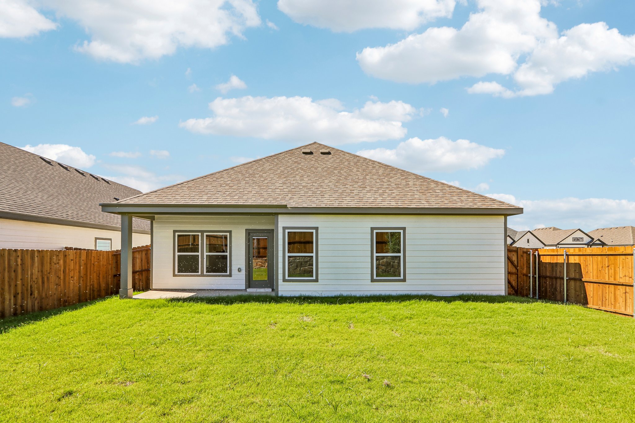 A house with a grass yard.