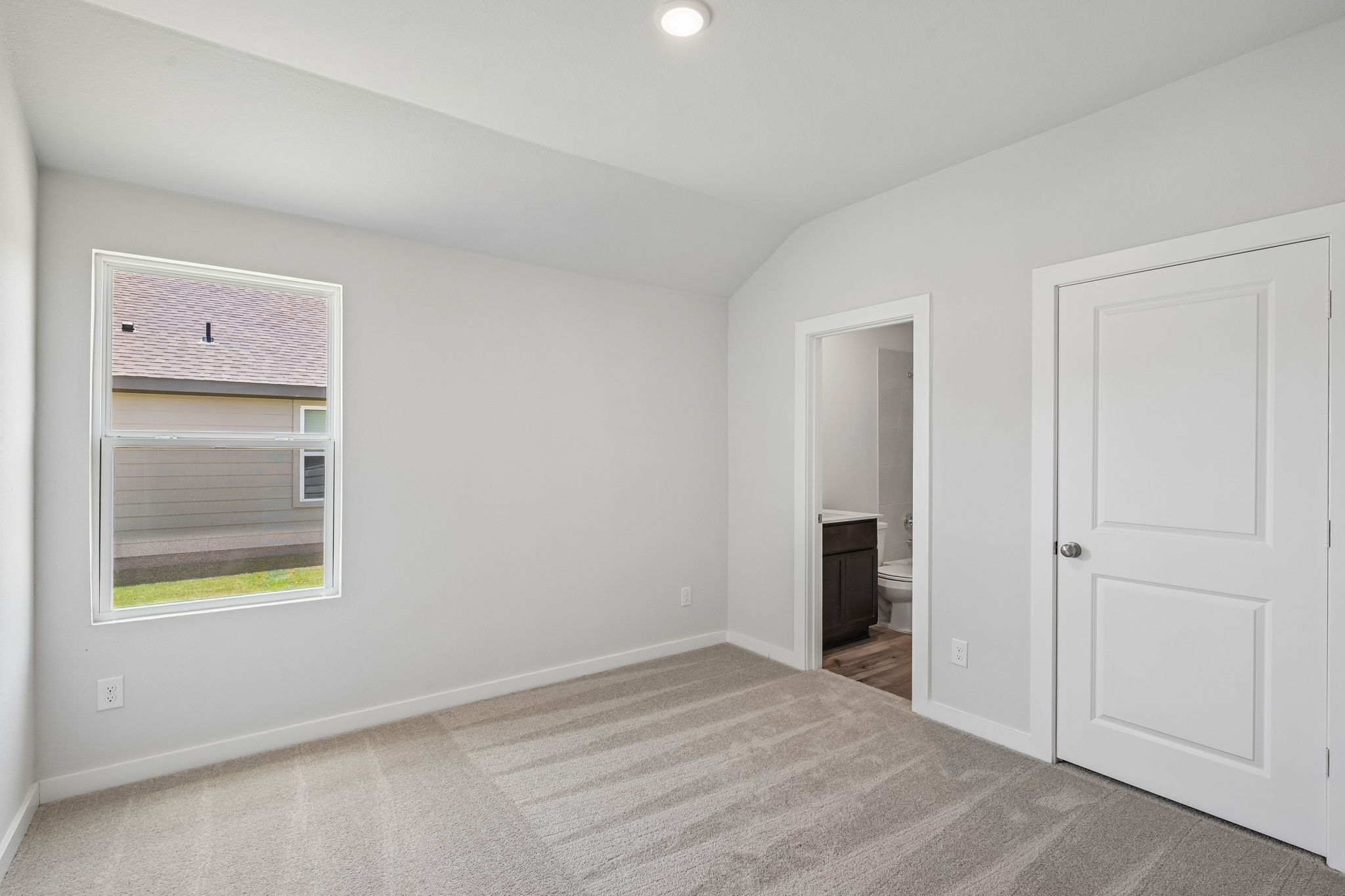 A room with a door and a window.