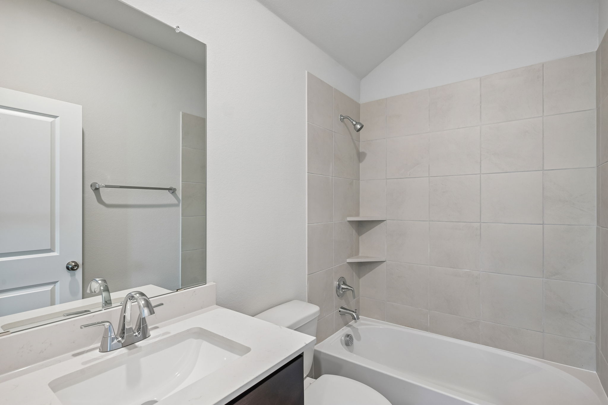 A bathroom with a sink and a toilet.