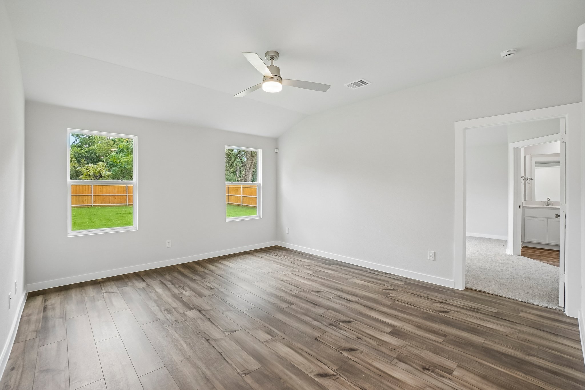 A room with a wood floor and a wood floor with a wood floor.