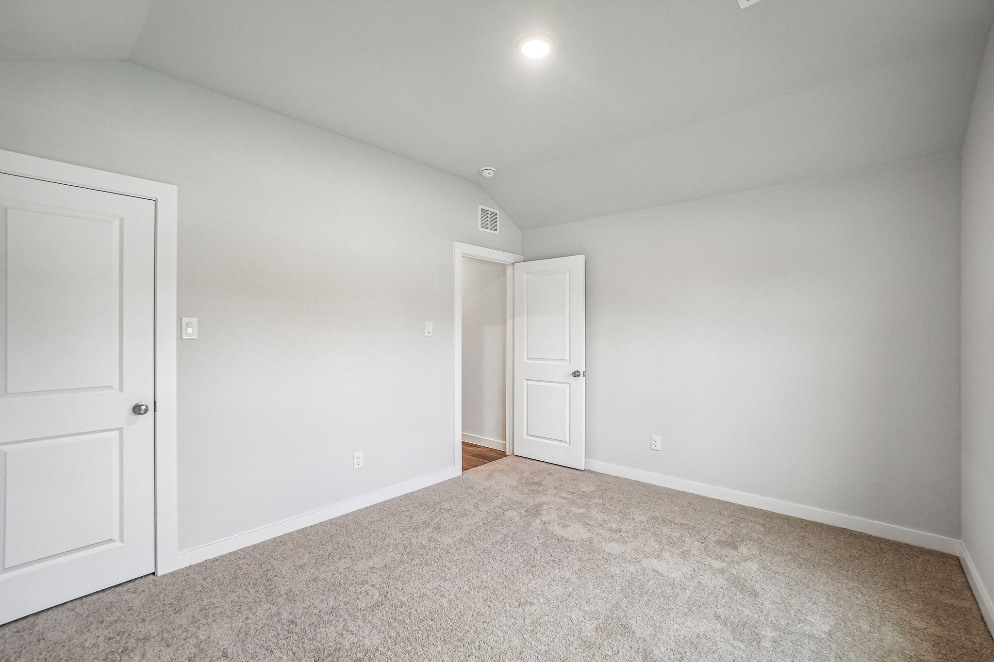 A room with white doors.