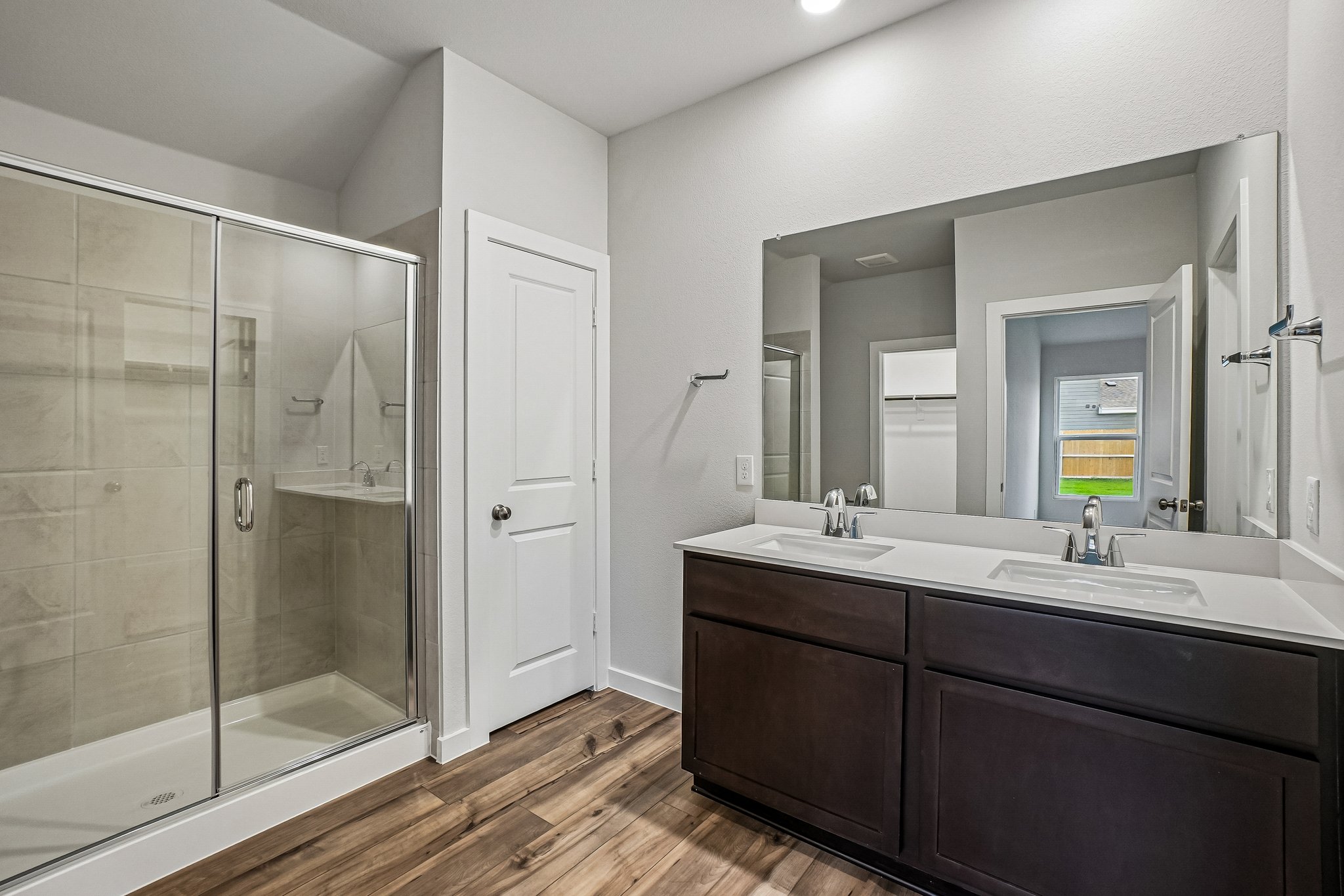 A bathroom with a glass shower.