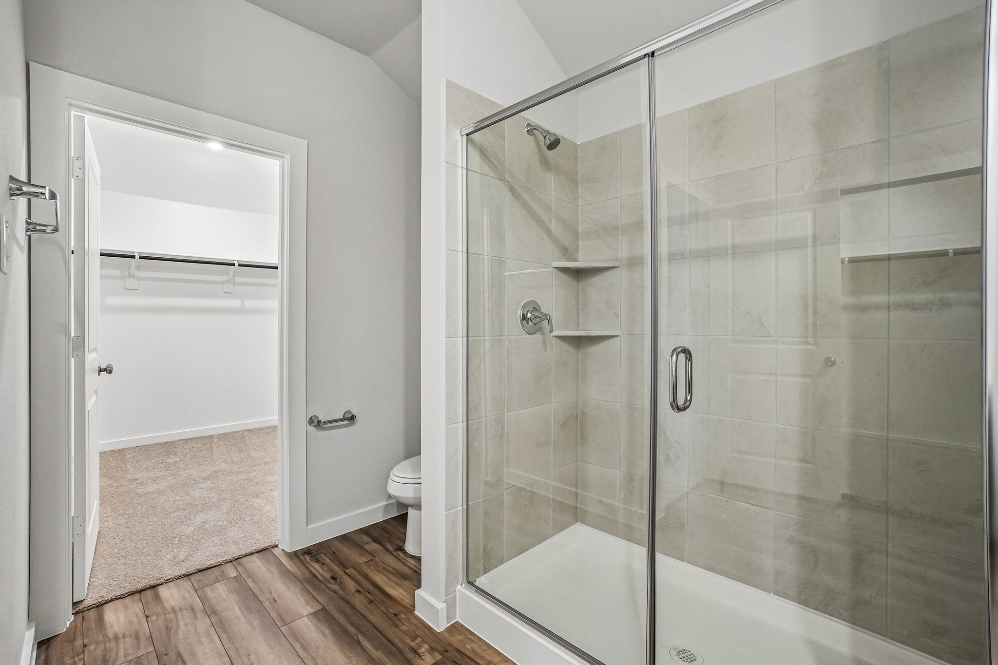 A bathroom with a glass shower.