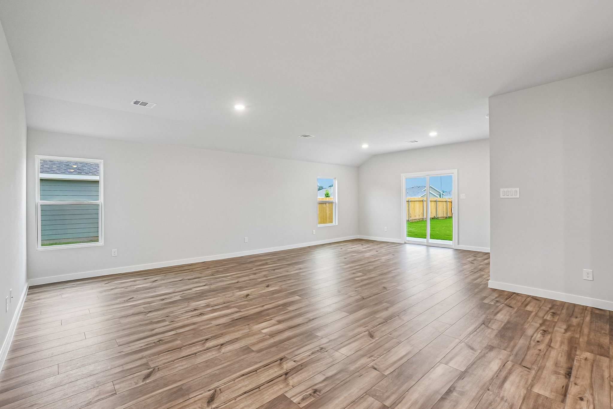 A room with a wood floor and a wood floor.