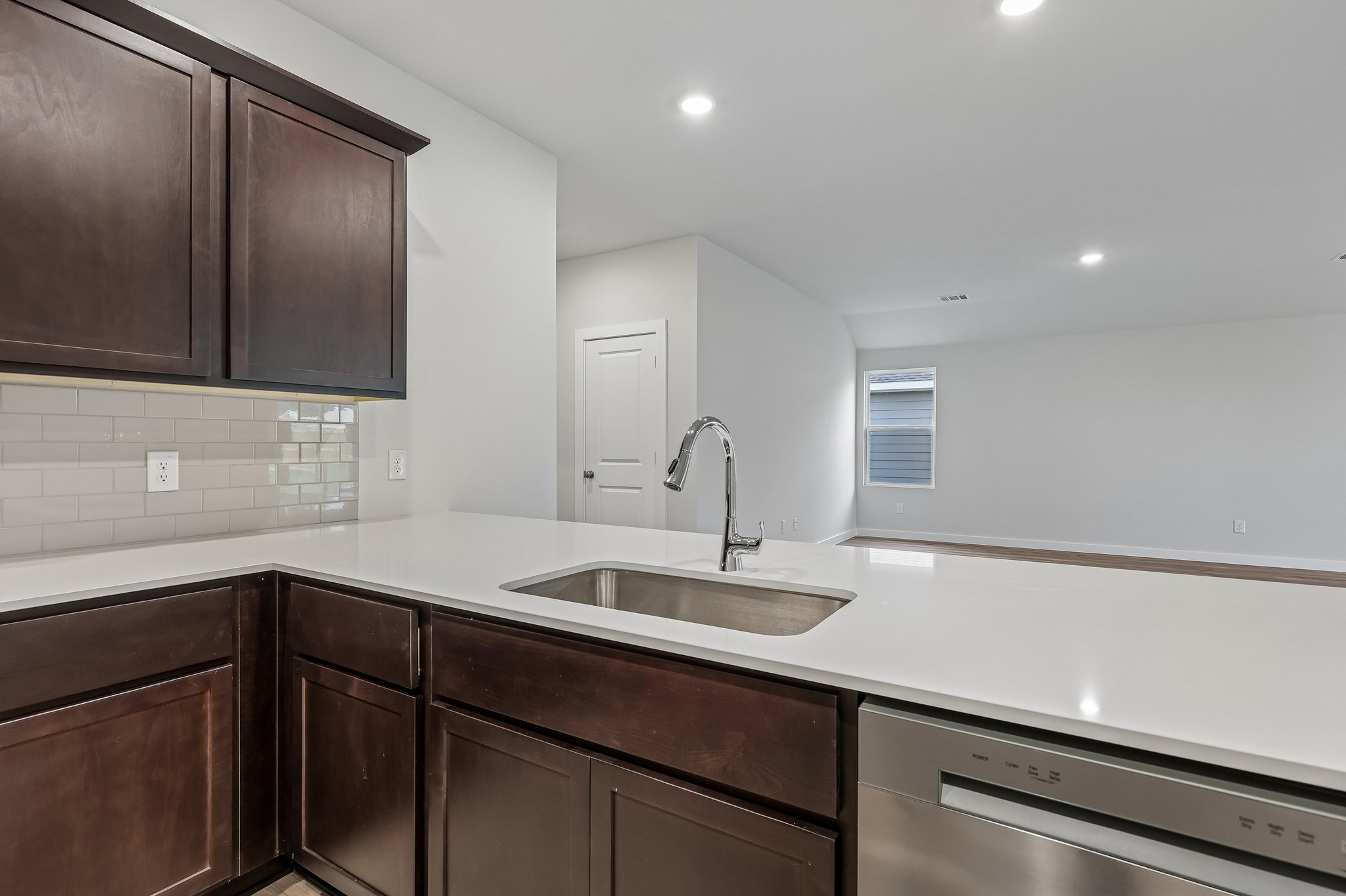 A kitchen with wooden cabinets.