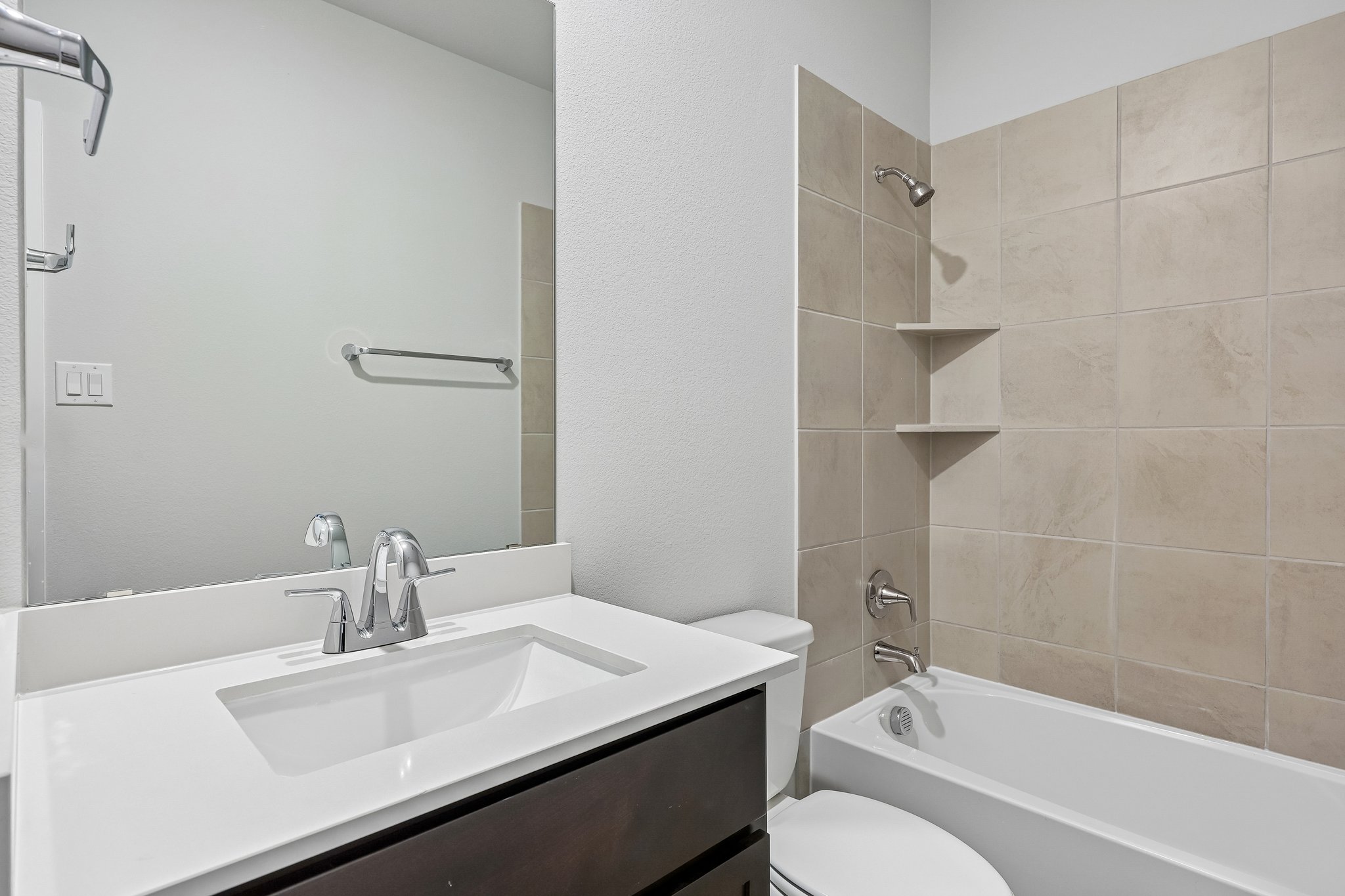 A bathroom with a sink and a toilet.