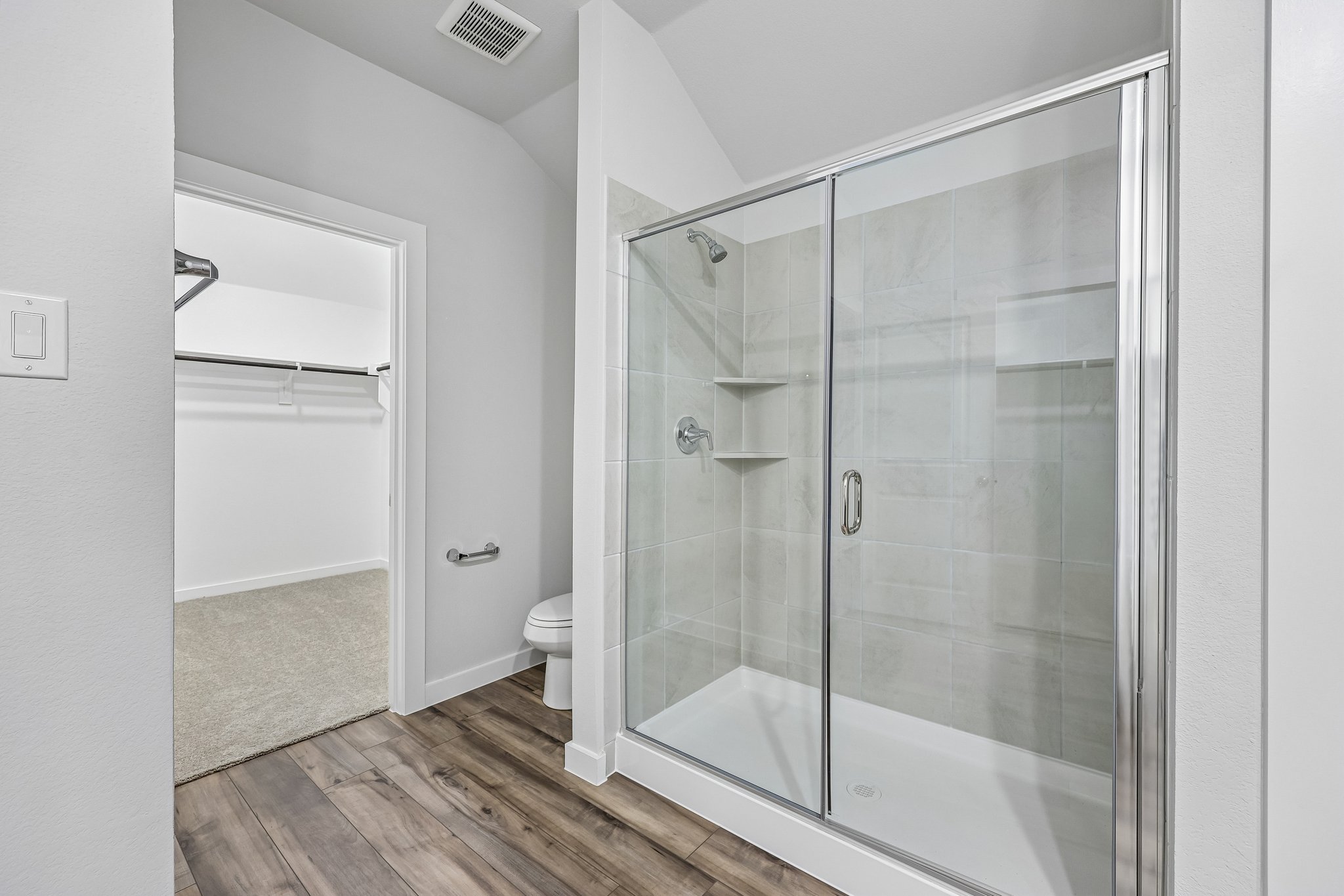 A bathroom with a glass shower.