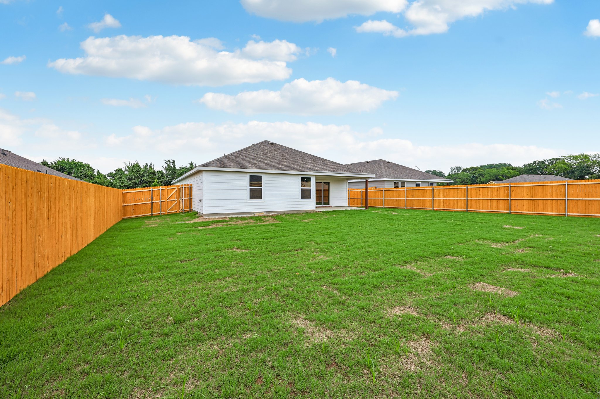 A house with a fence around it.