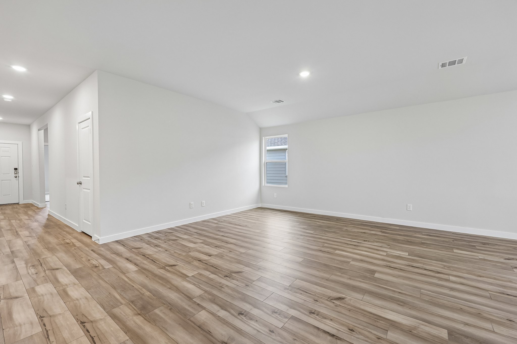 A room with wood floors.