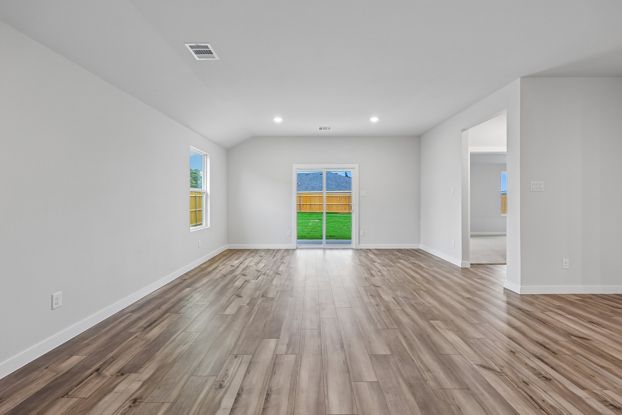 A room with a wood floor and a wood floor.