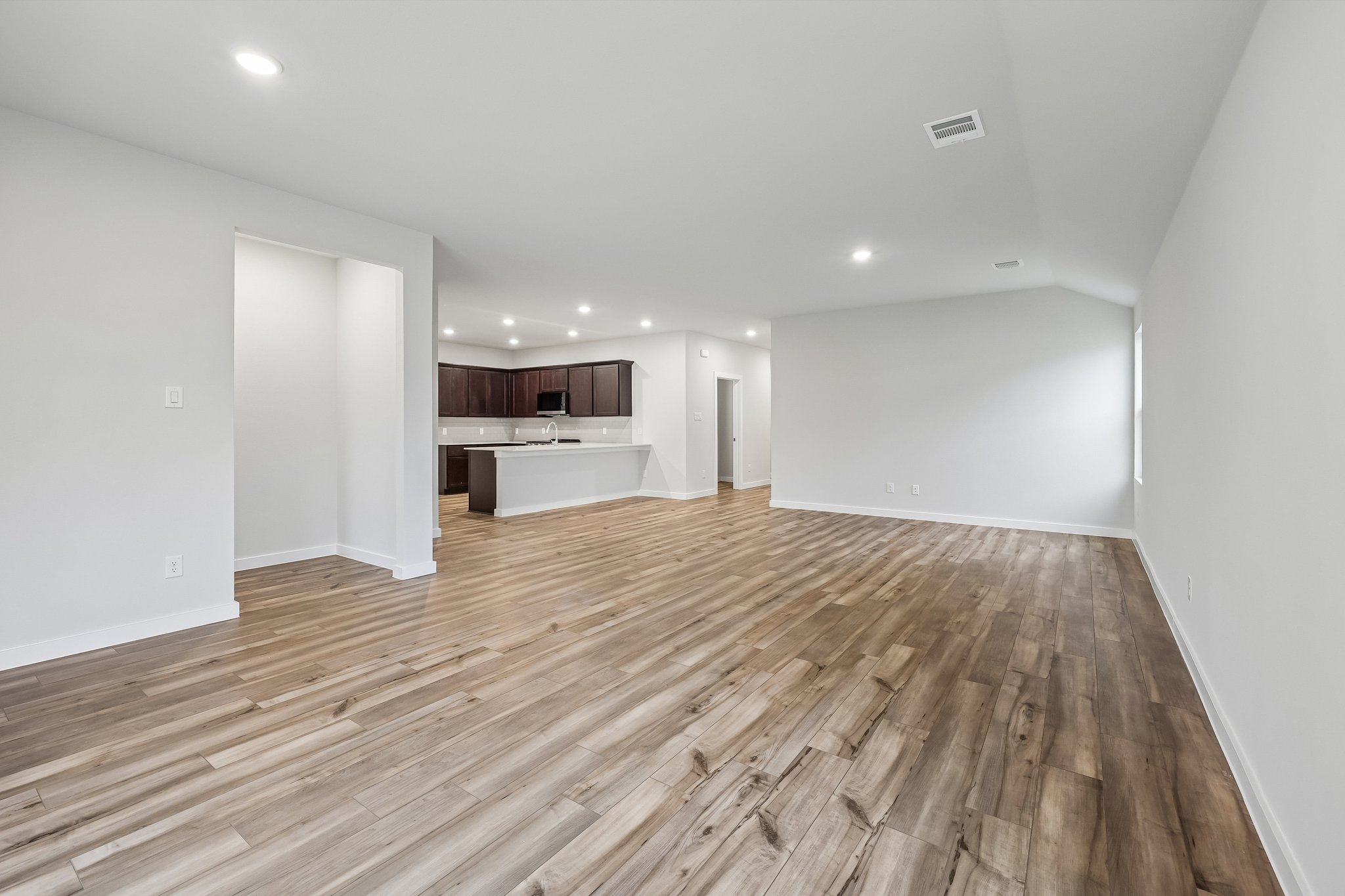 A room with wood floors.