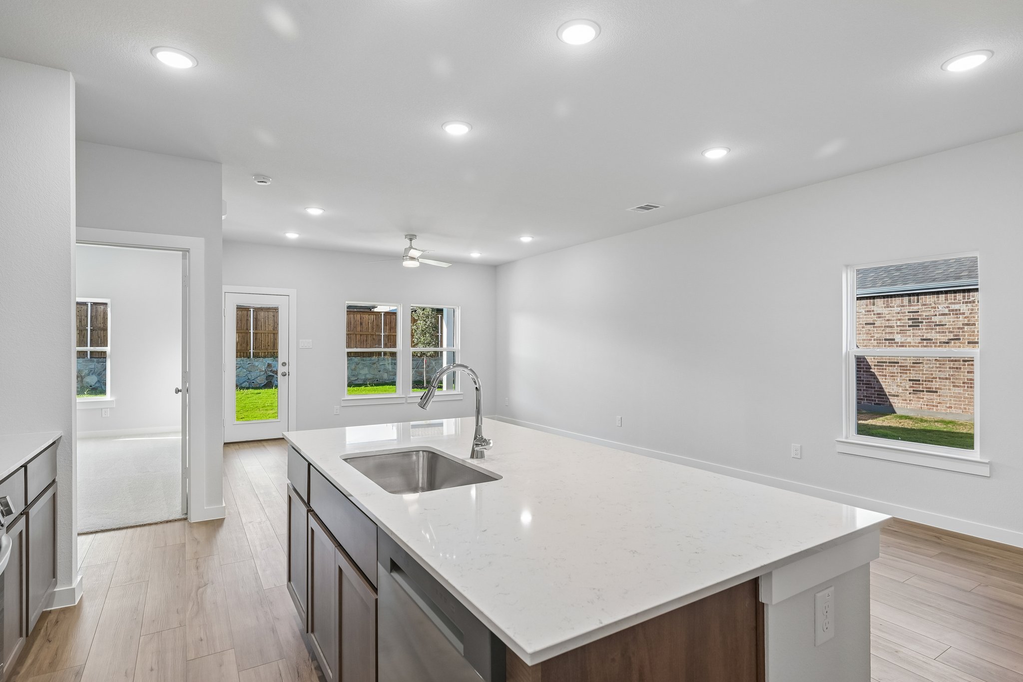 A kitchen with a sink and a counter top.