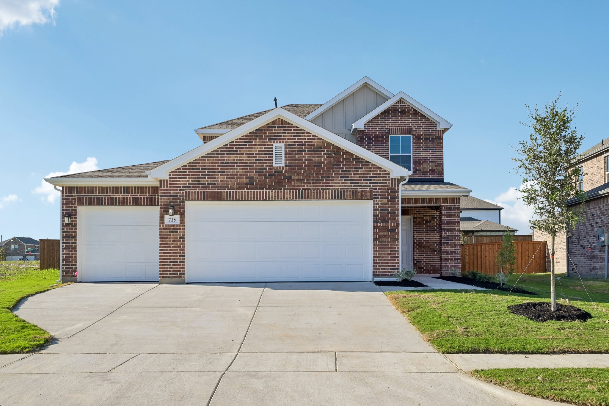 A brick building with garages.