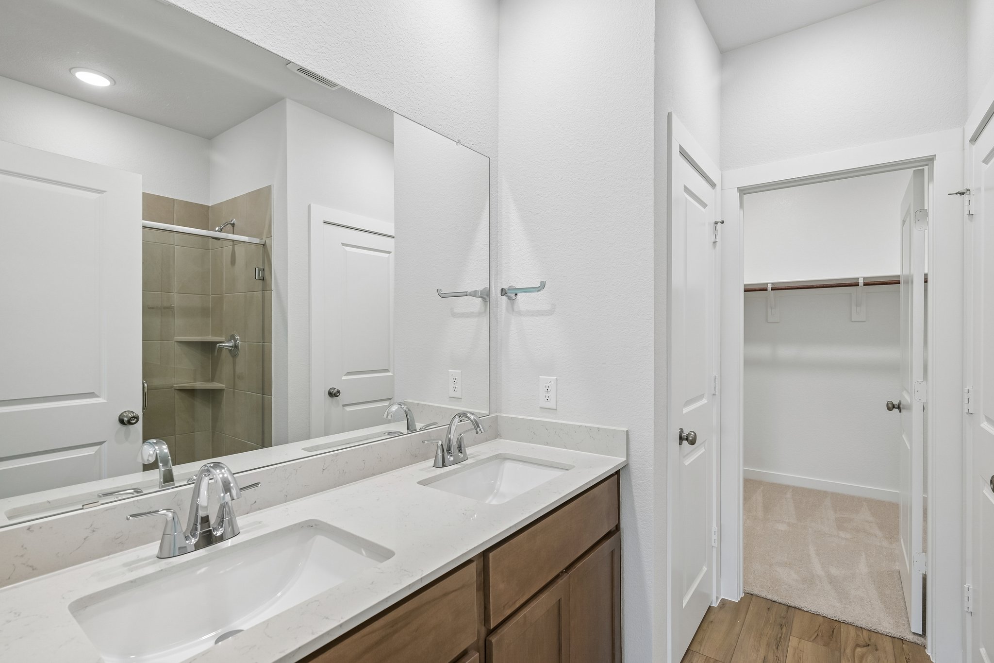 A bathroom with a glass shower.