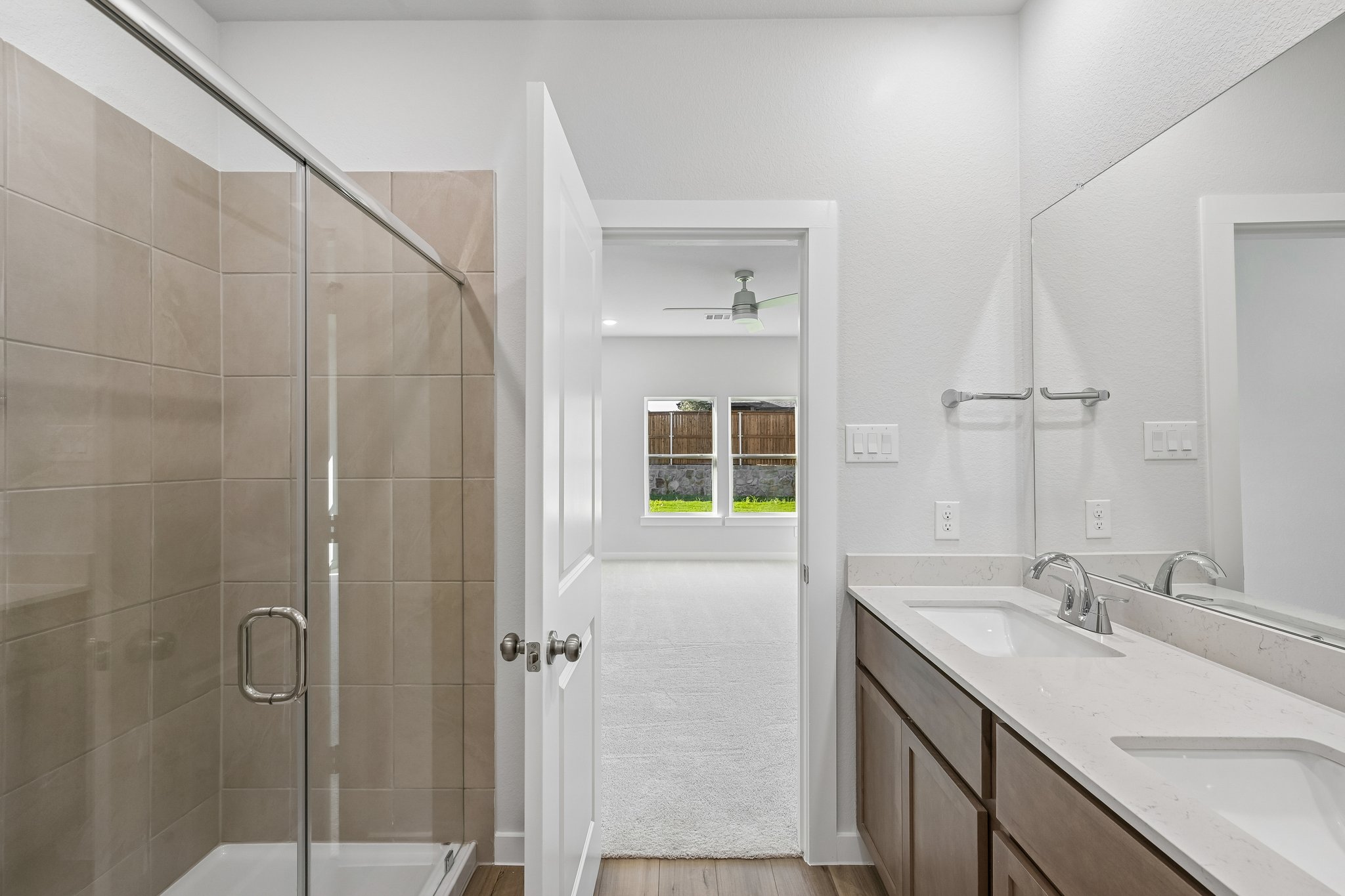 A bathroom with a glass shower.
