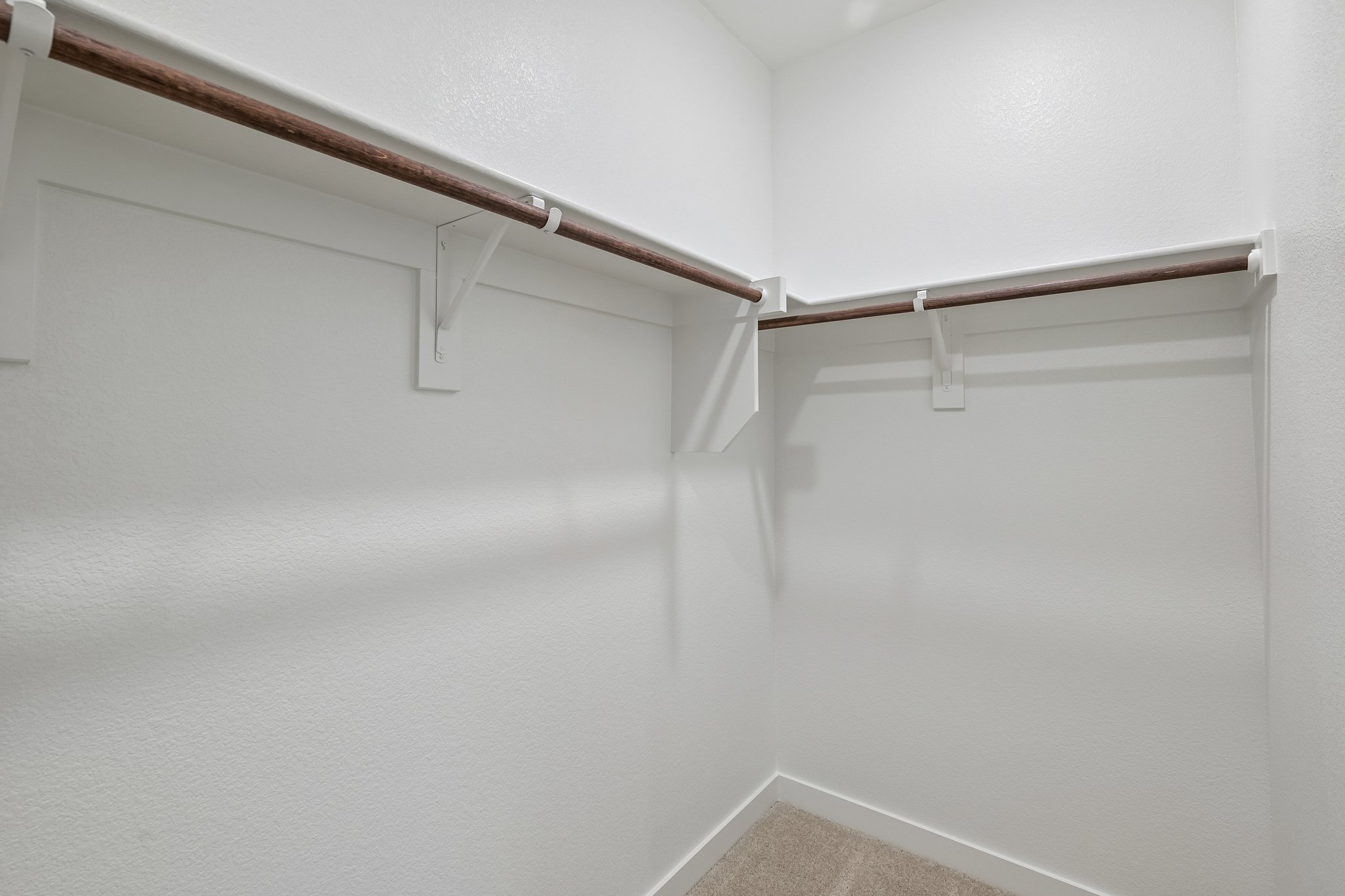 A white staircase with a railing.