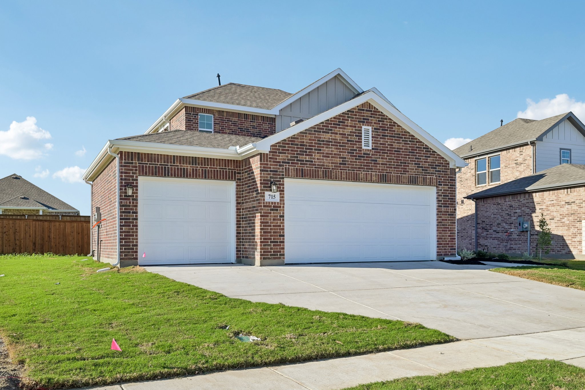 A brick building with garages.