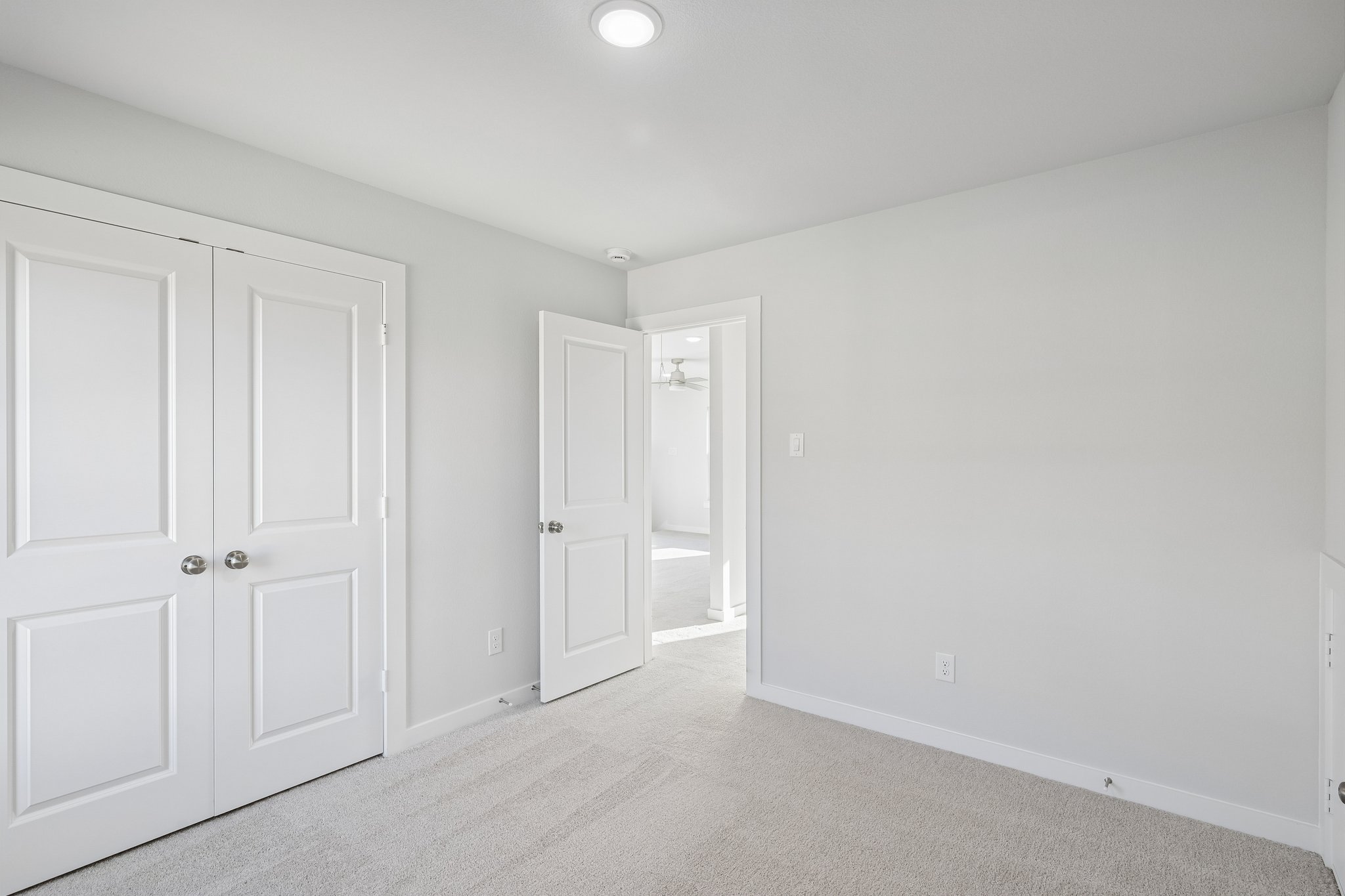 A room with white doors.