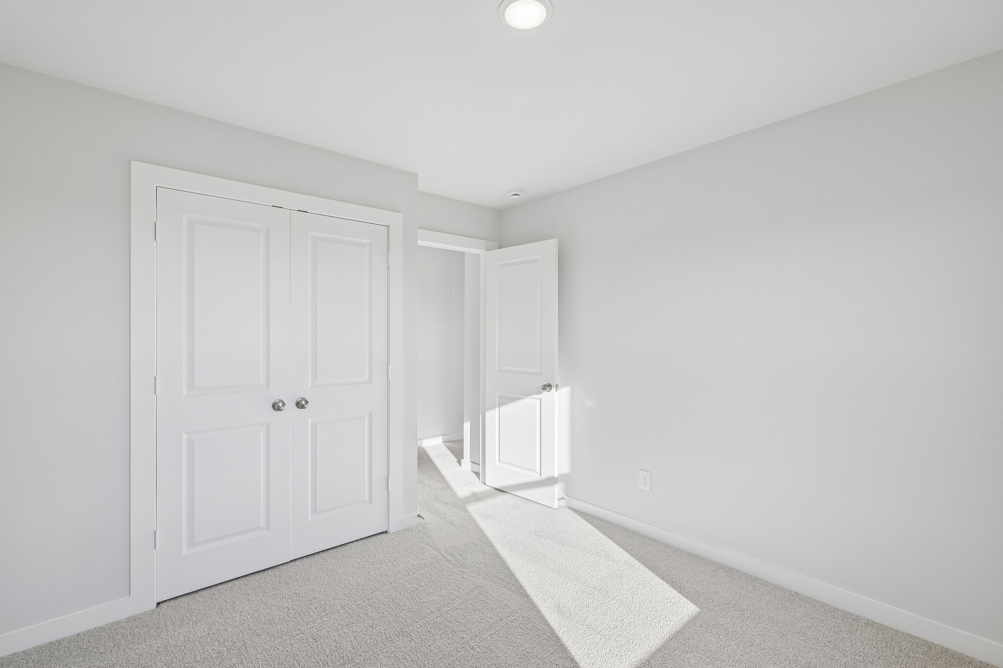 A room with white doors.