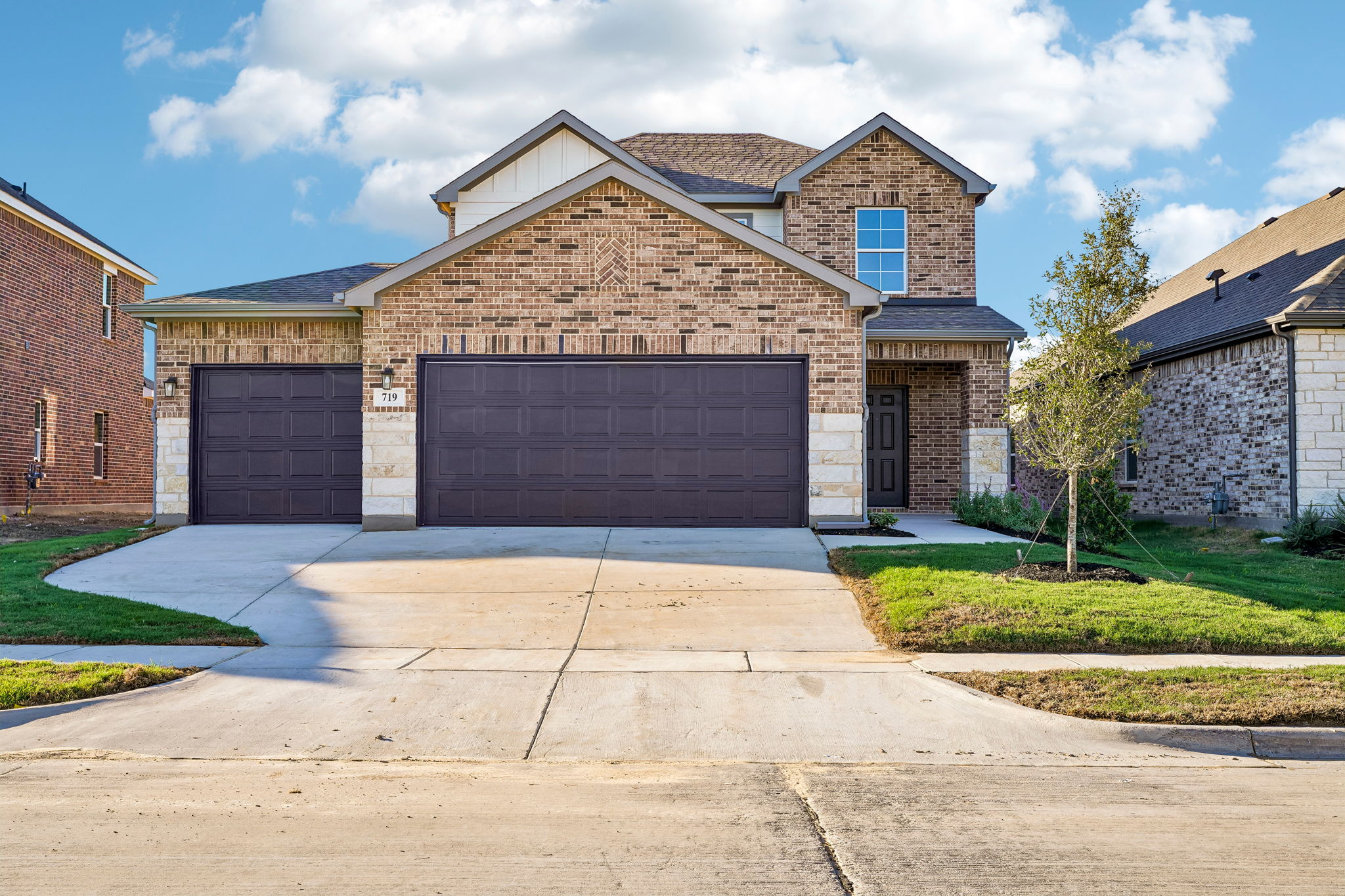 A brick building with garages.