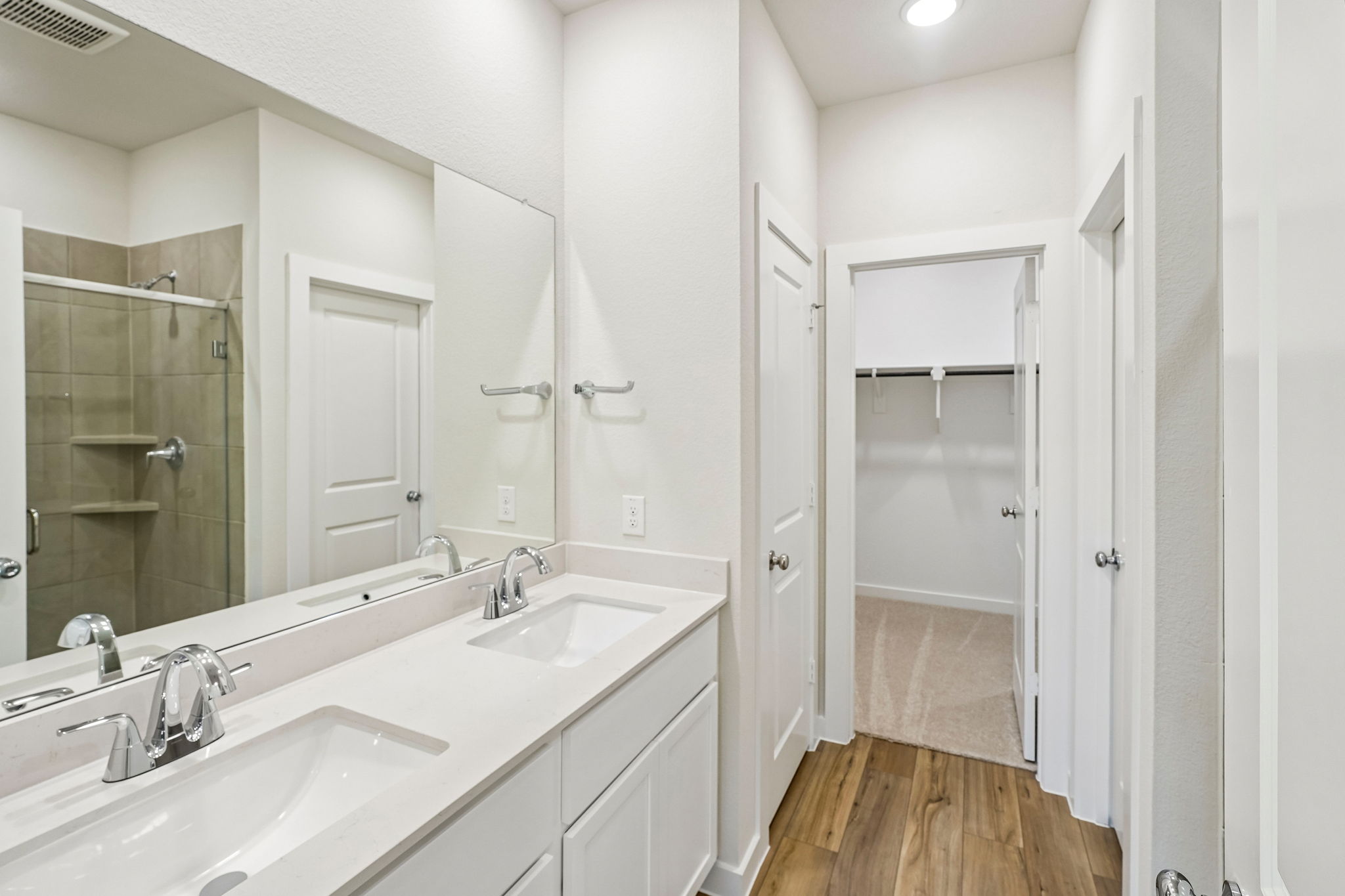 A bathroom with a glass shower.