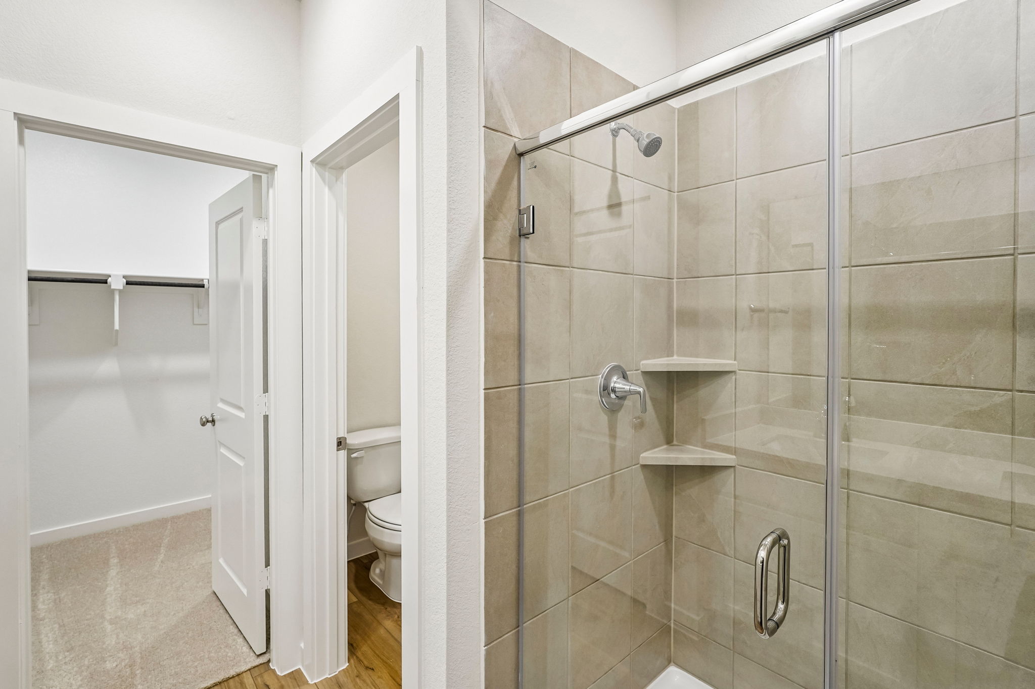 A bathroom with a glass shower.