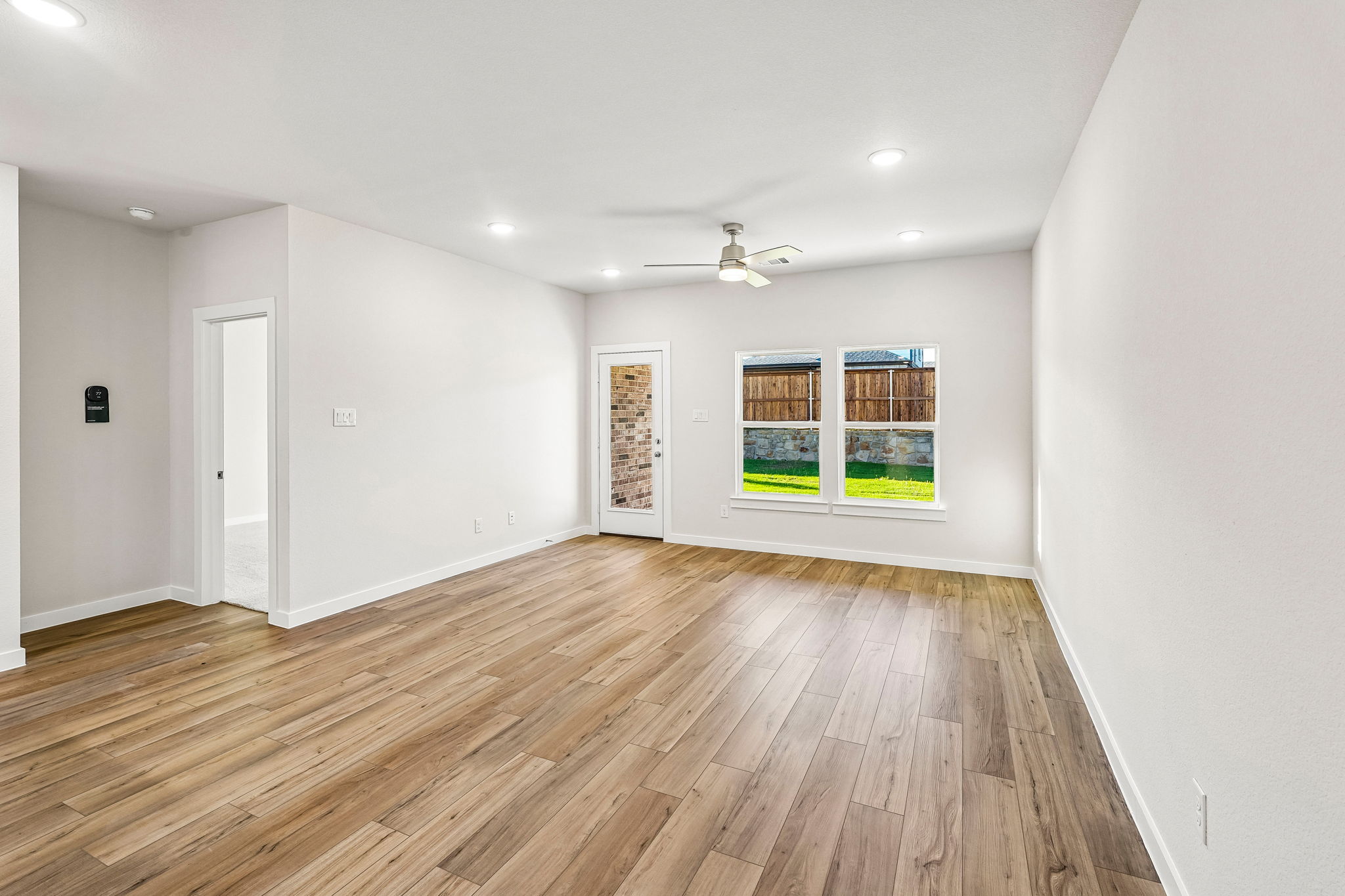 A room with a wood floor and a wood floor with a wood floor.