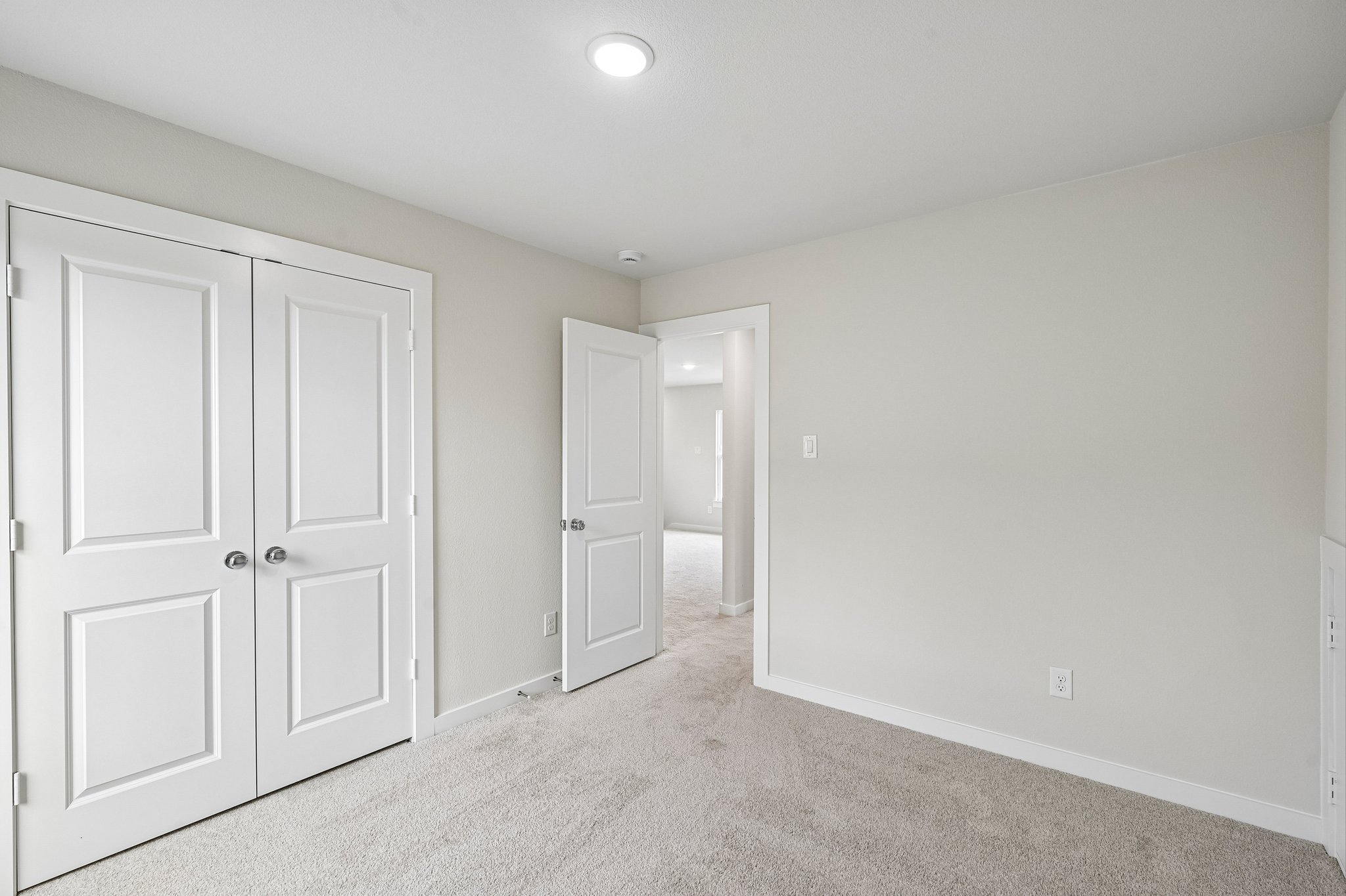 A room with white doors.