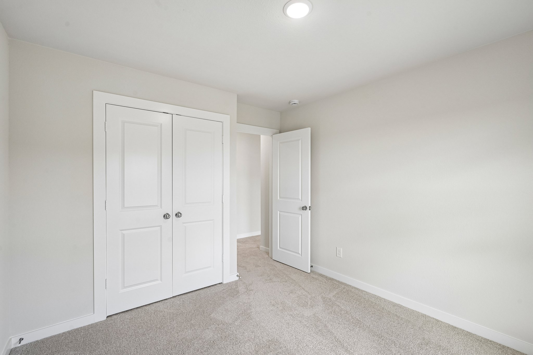 A room with white doors.