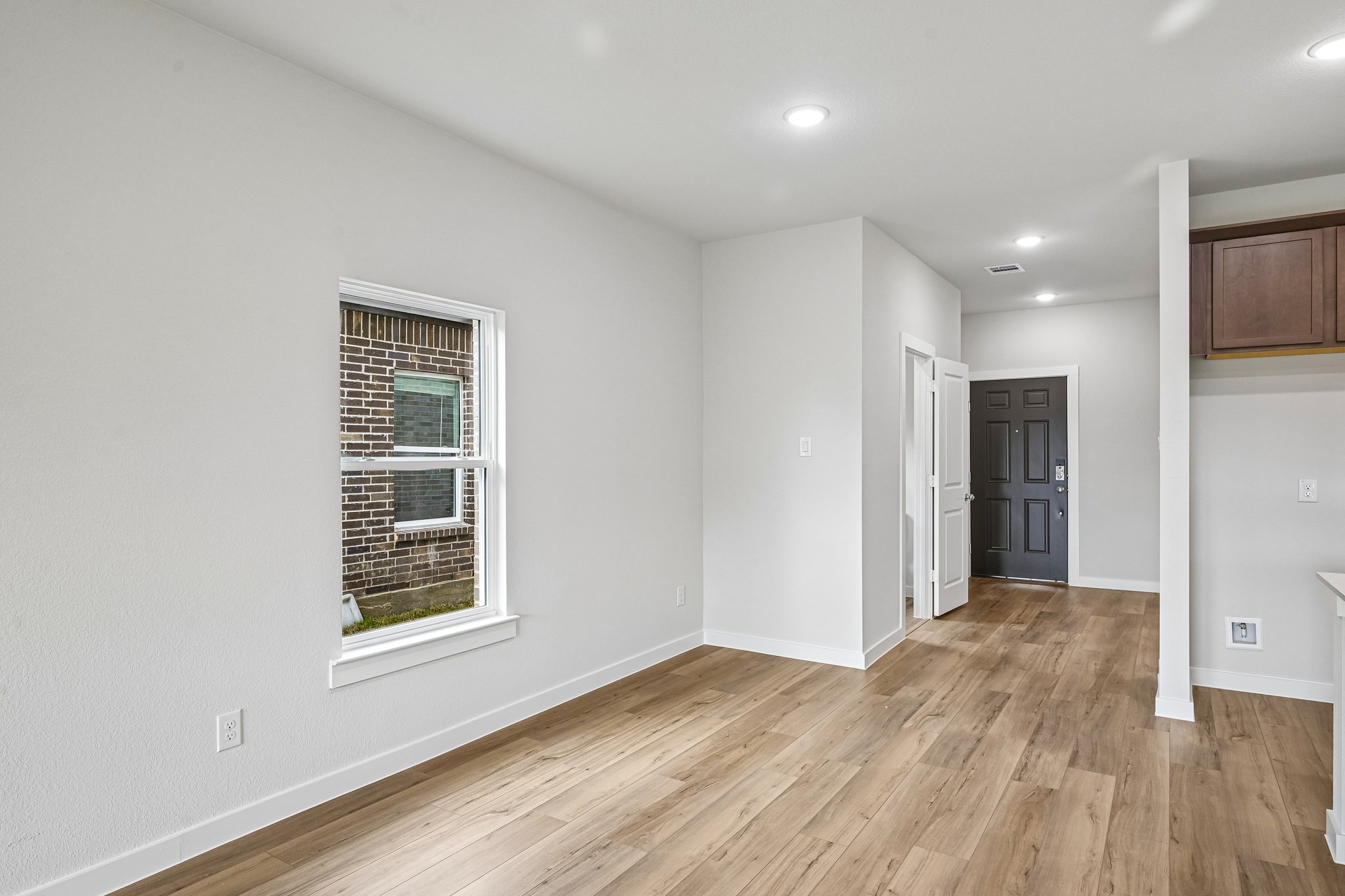 A room with a wood floor and a wood floor.