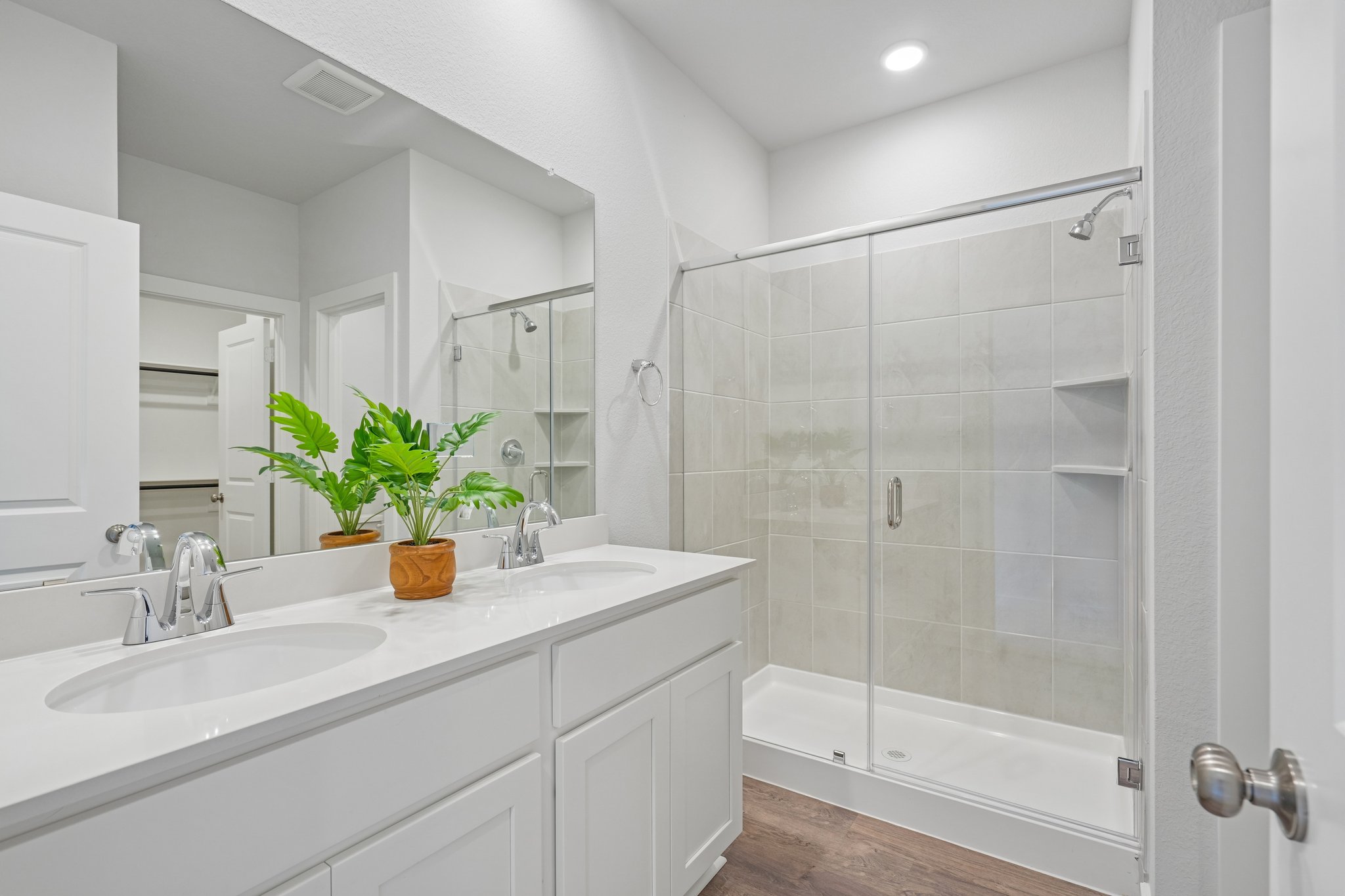 A bathroom with a glass shower.