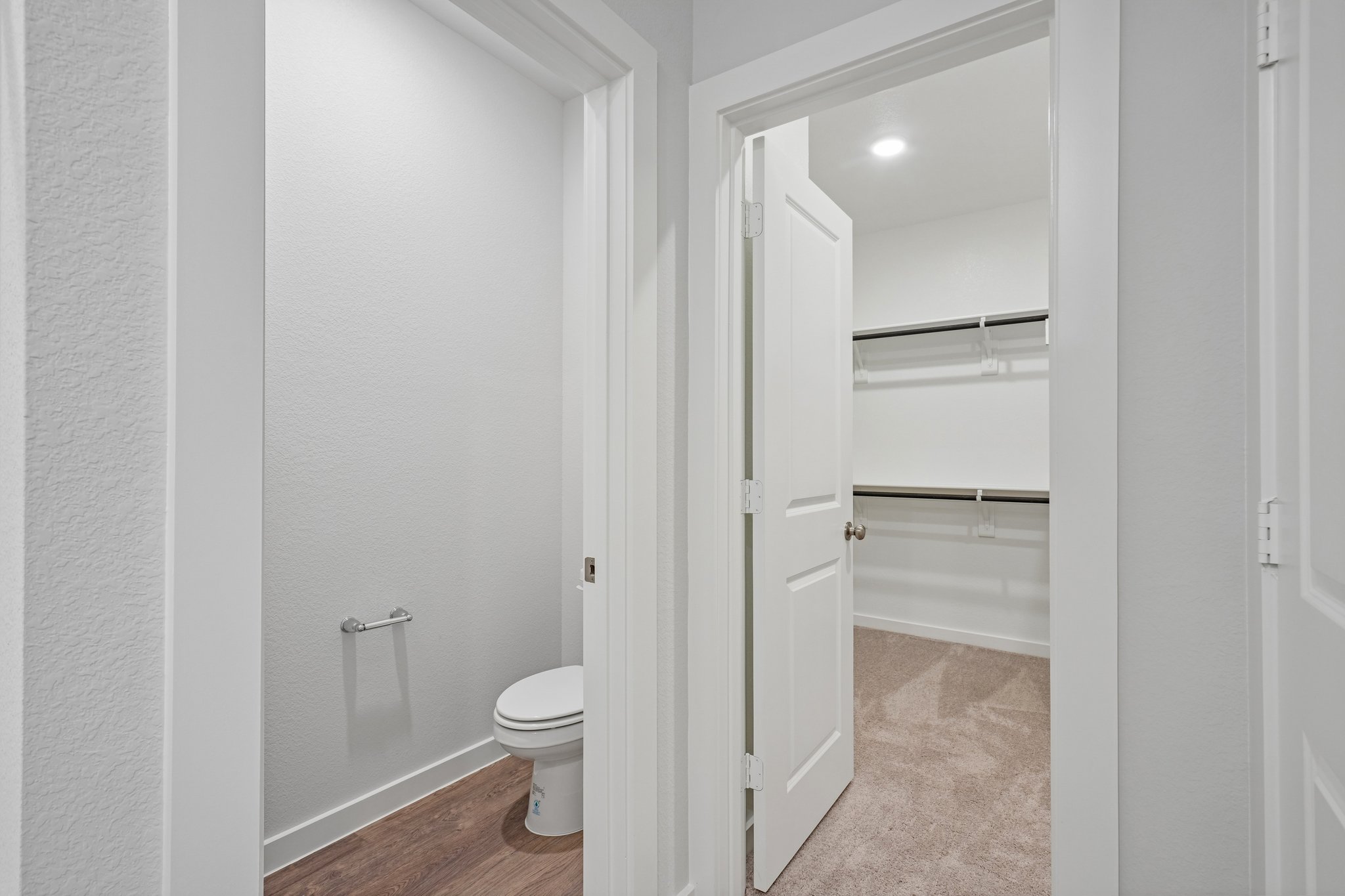A bathroom with a toilet and shower.