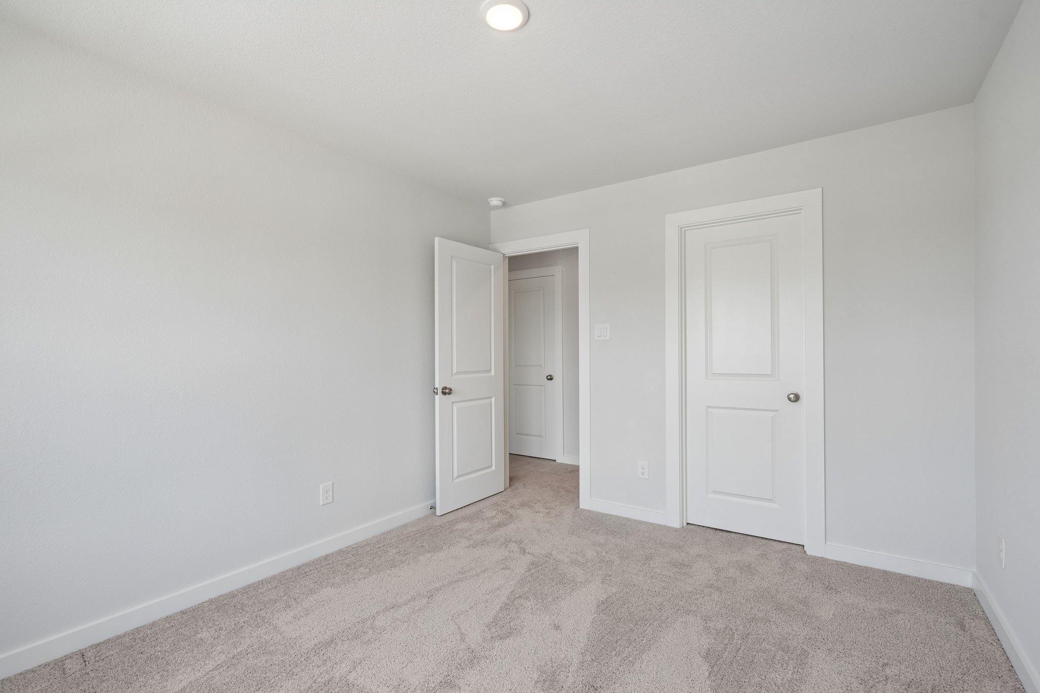 A room with white doors.