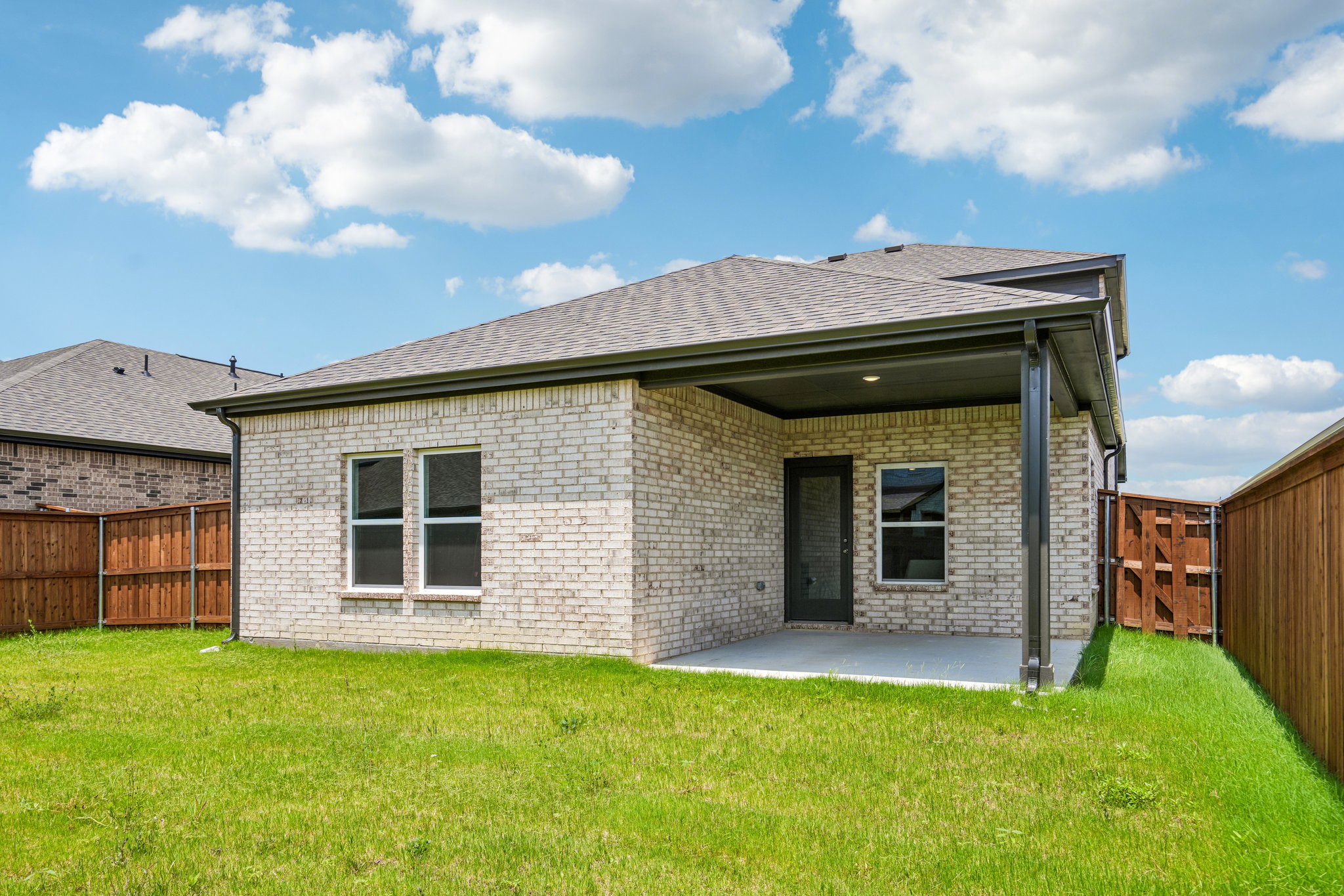A house with a grass yard.