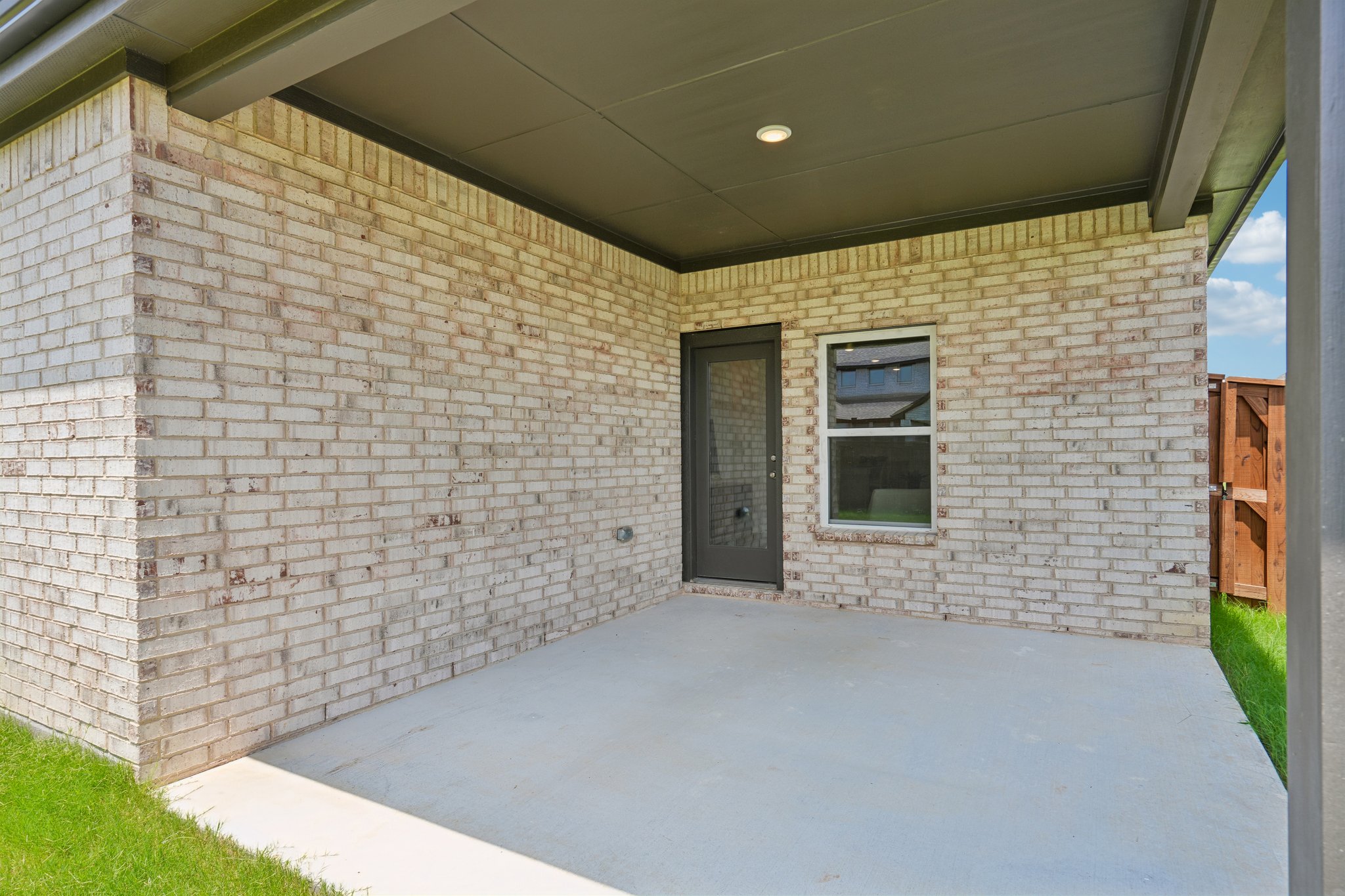 A brick building with a white door.