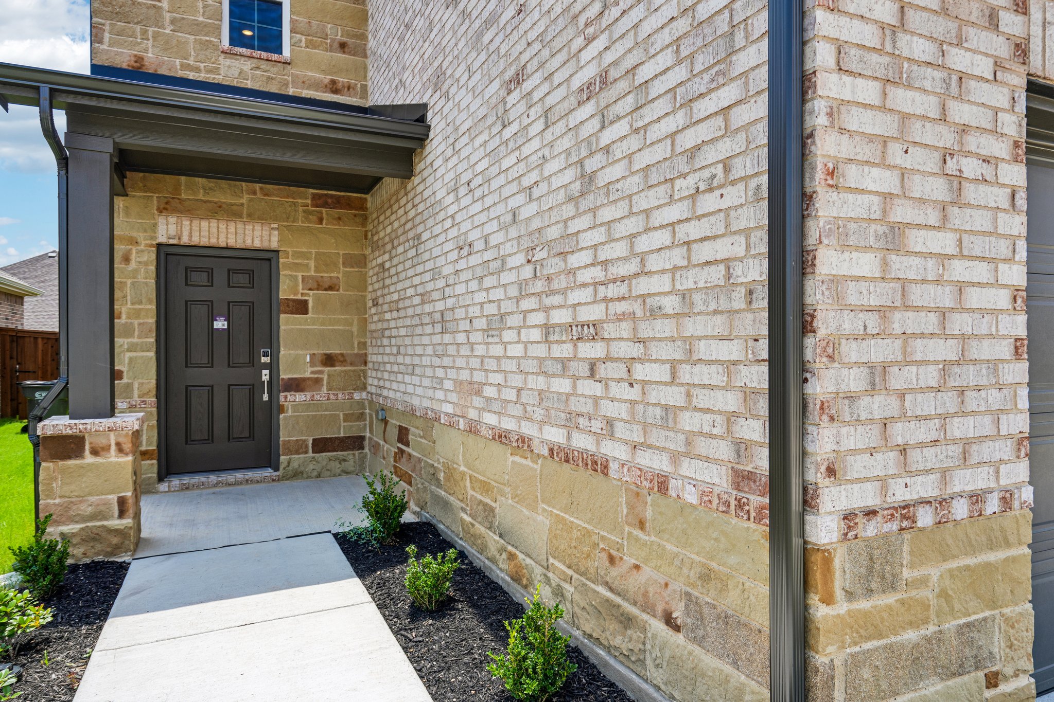 A brick building with a door.