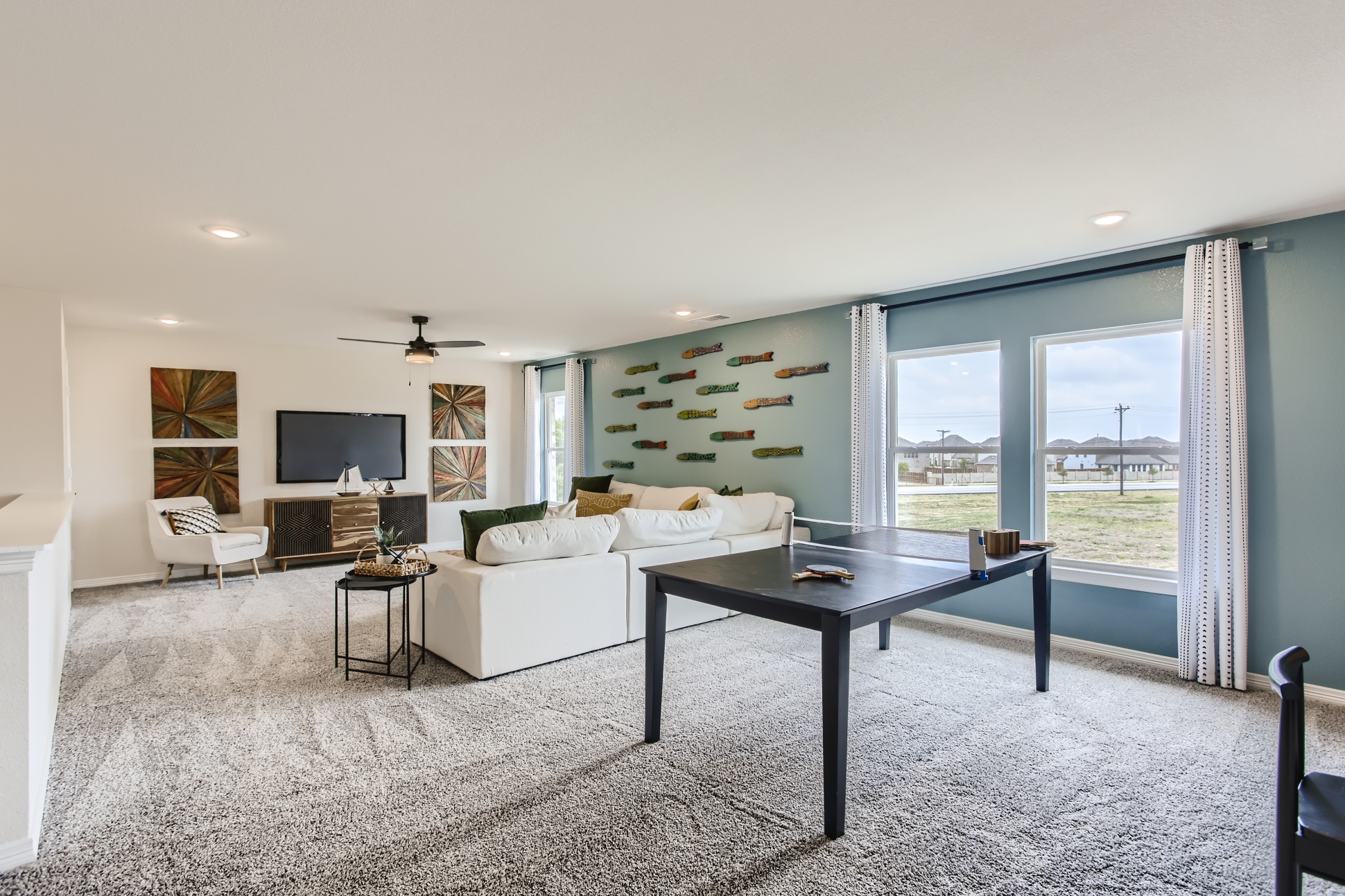 A living room with a large window.