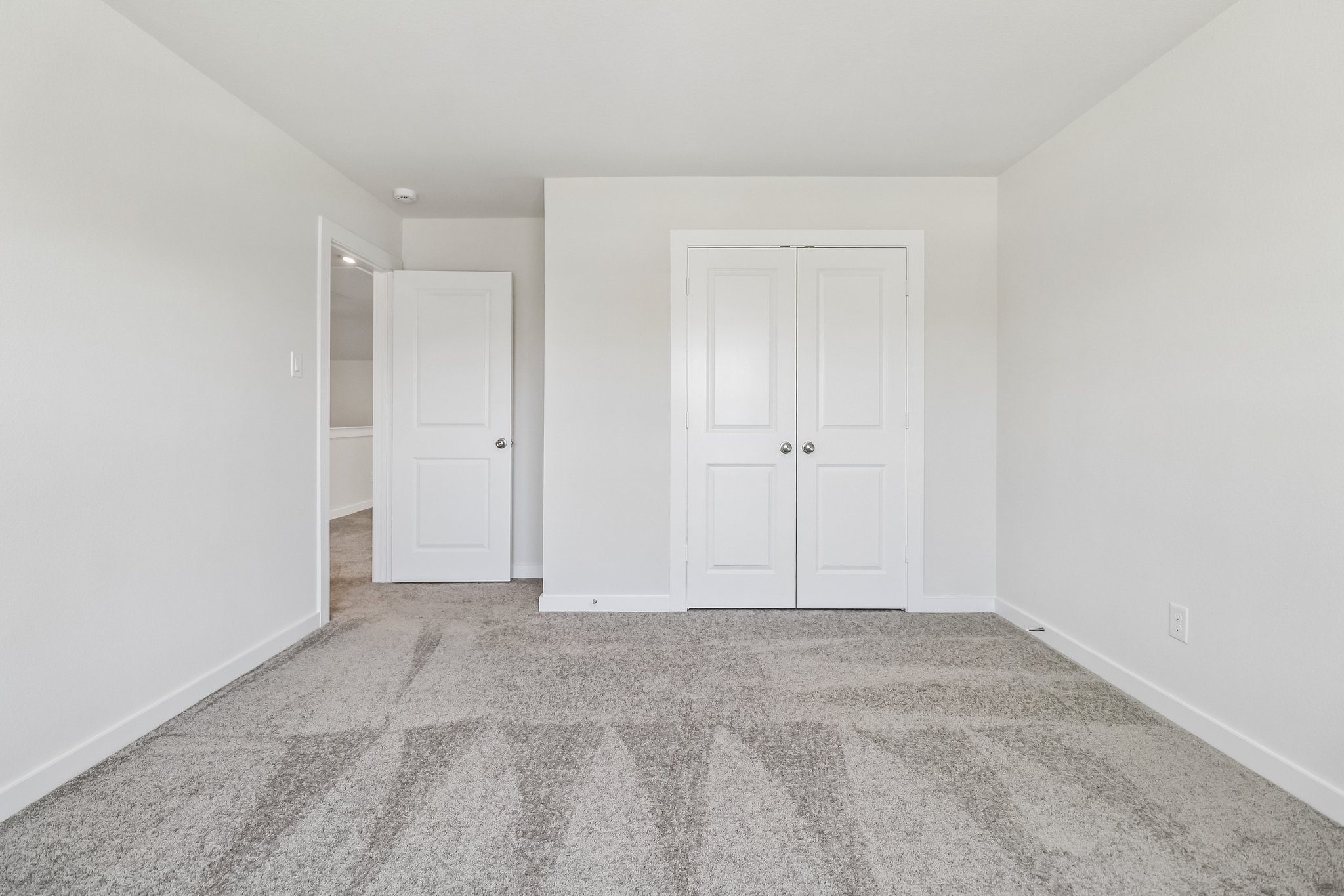 A room with white doors.