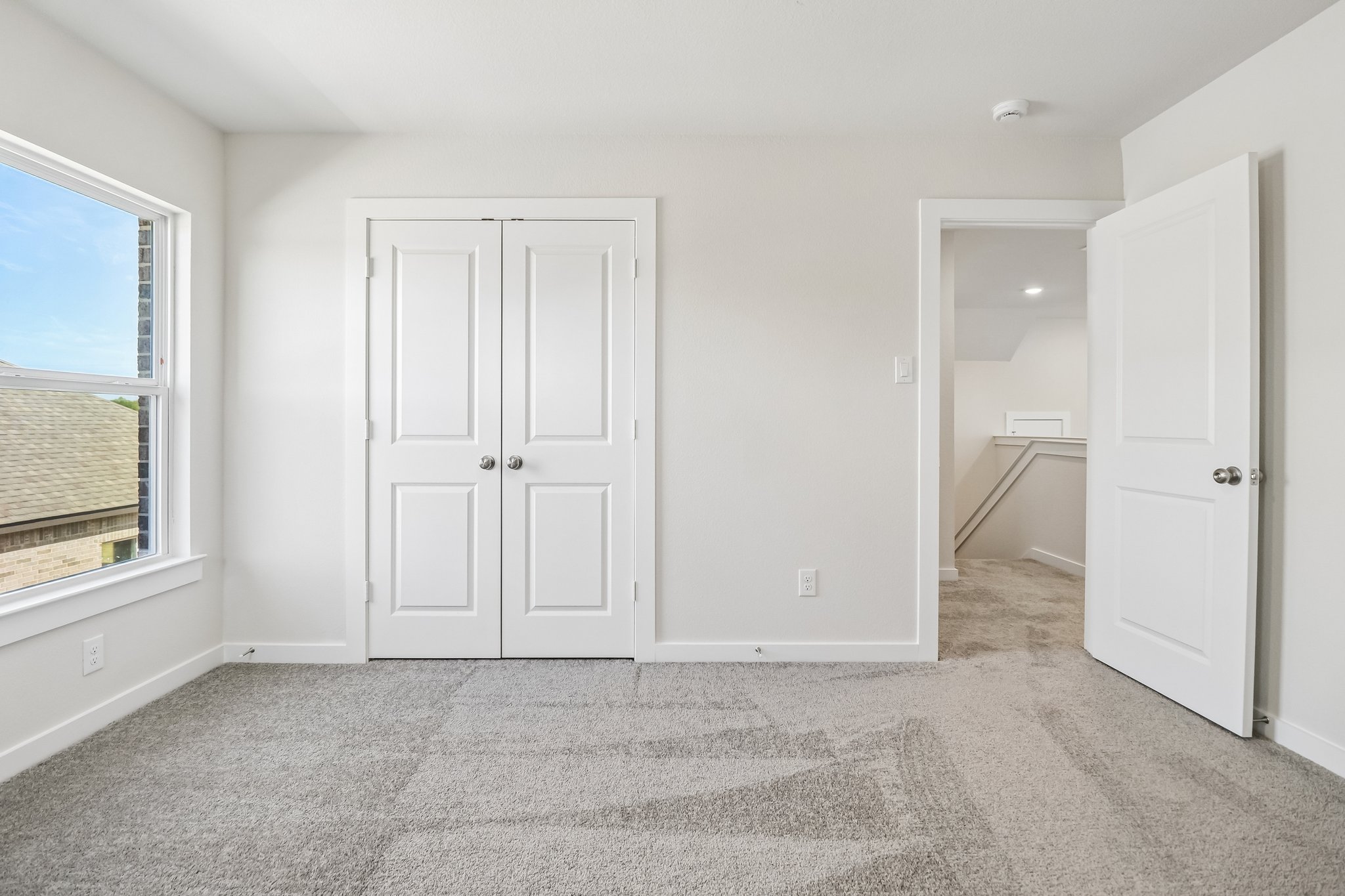 A room with white doors.