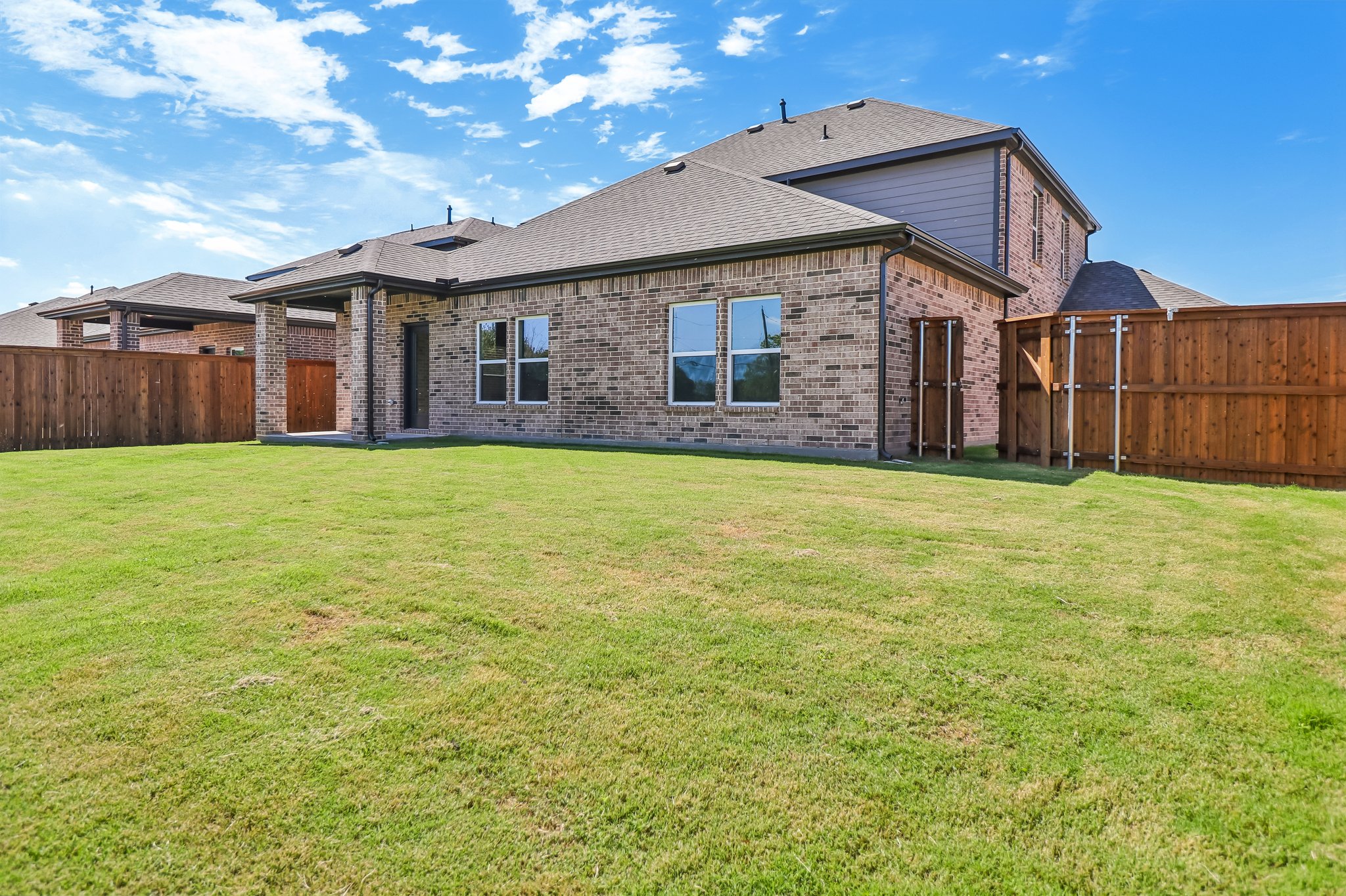 A house with a grass yard.