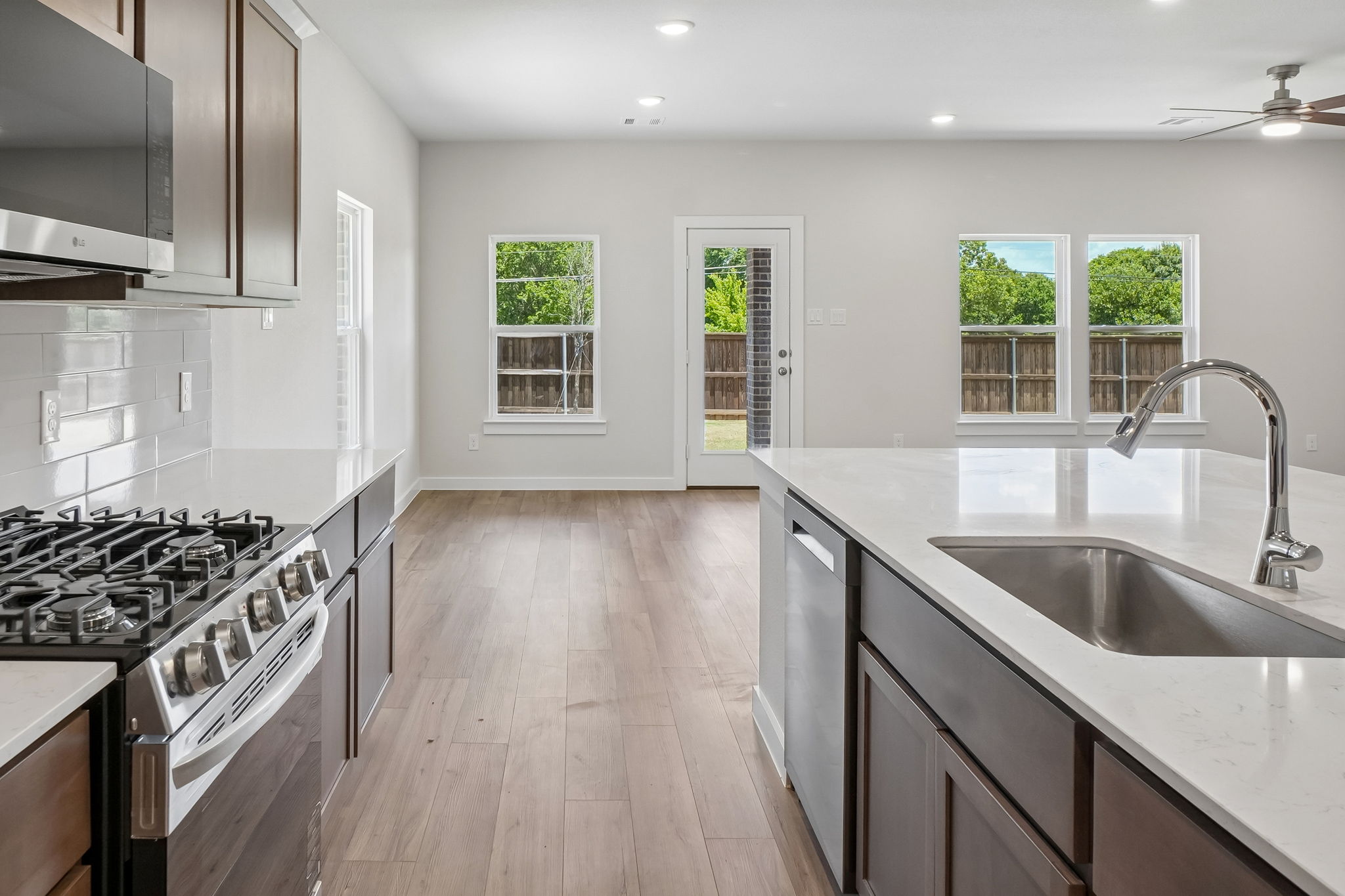 A kitchen with a wood floor.