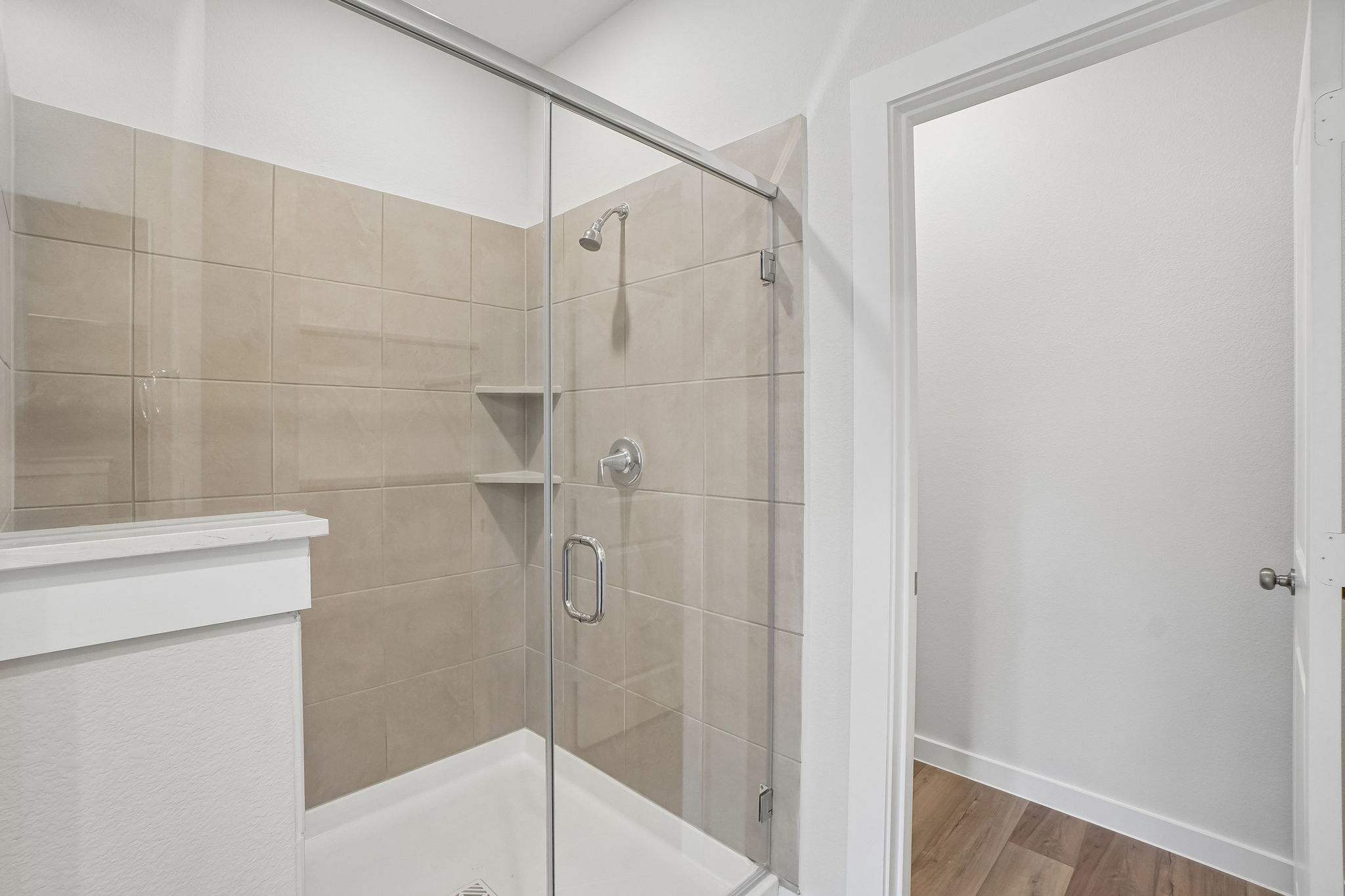 A bathroom with a glass shower.