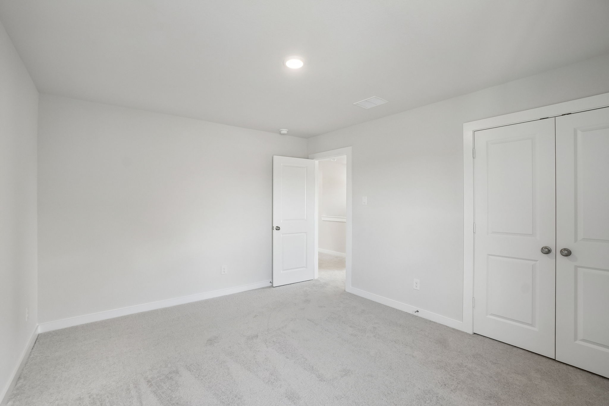 A room with white doors.