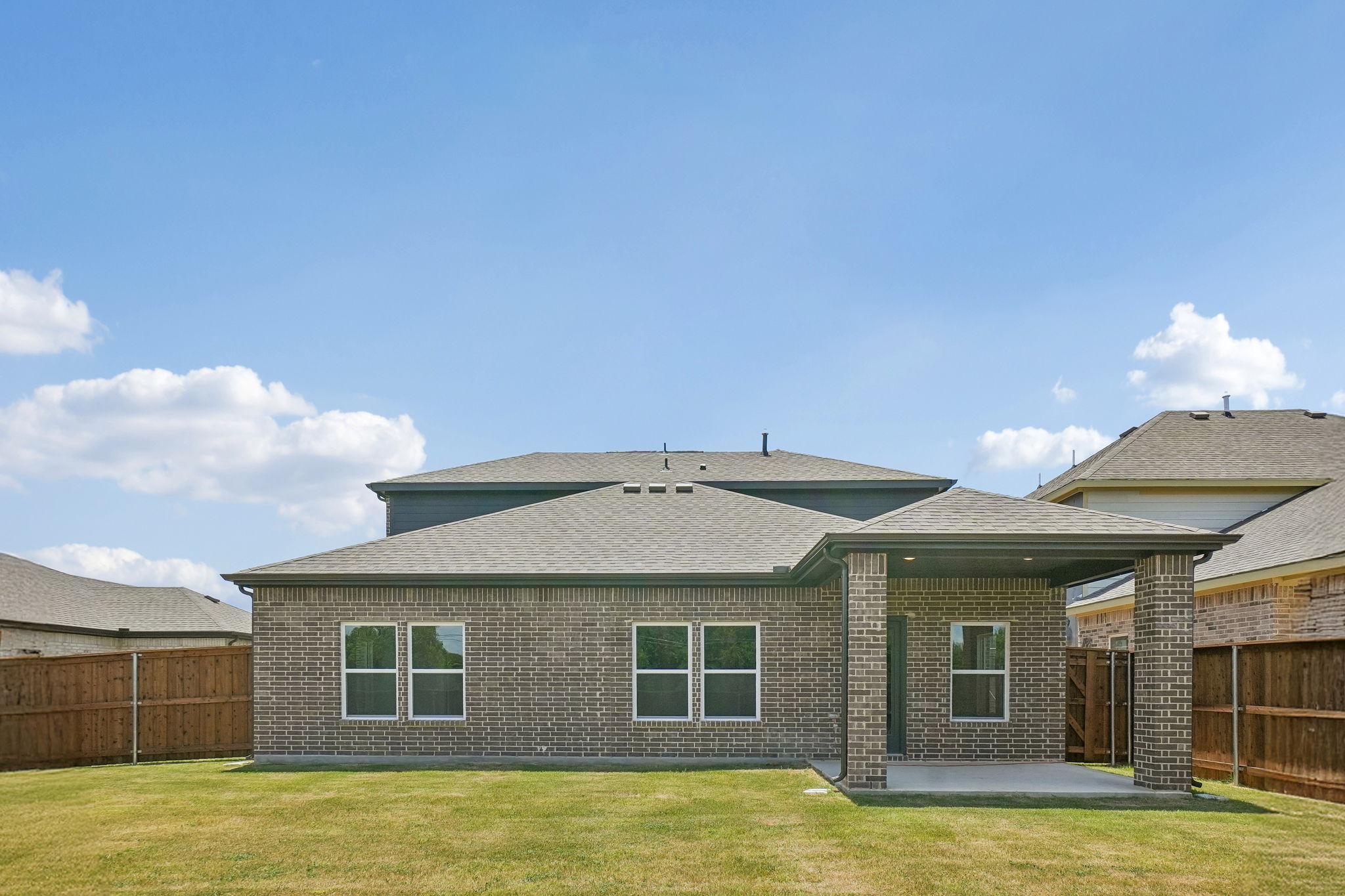 A house with a grass yard.