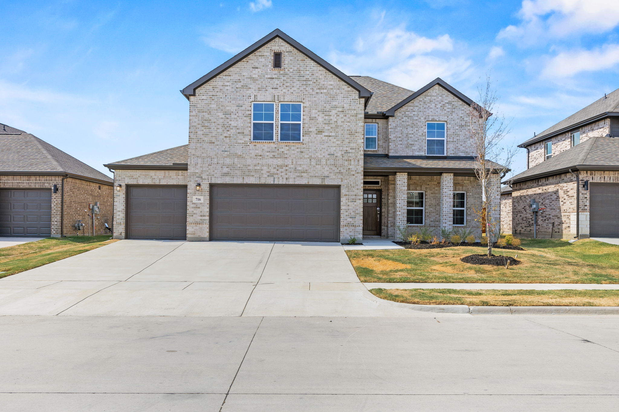 A large house with a driveway.